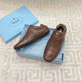 PRADA TASSEL LOAFERS IN RUSSET BROWN LAMBSKIN