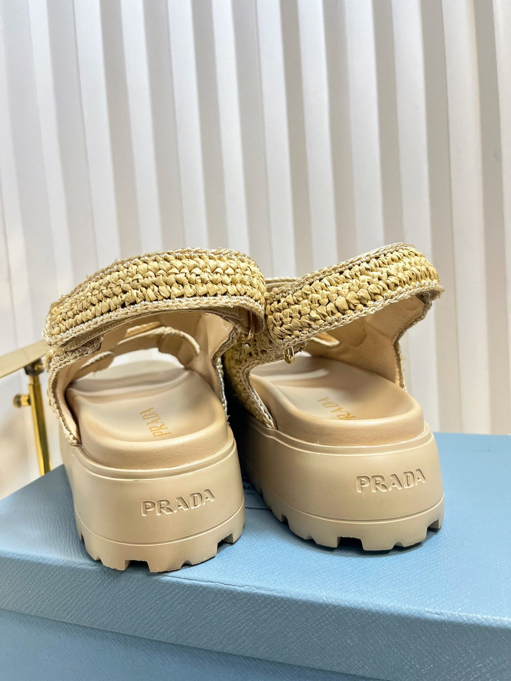 PRADA THICK-SOLED SLIDE IN BEIGE RAFFIA