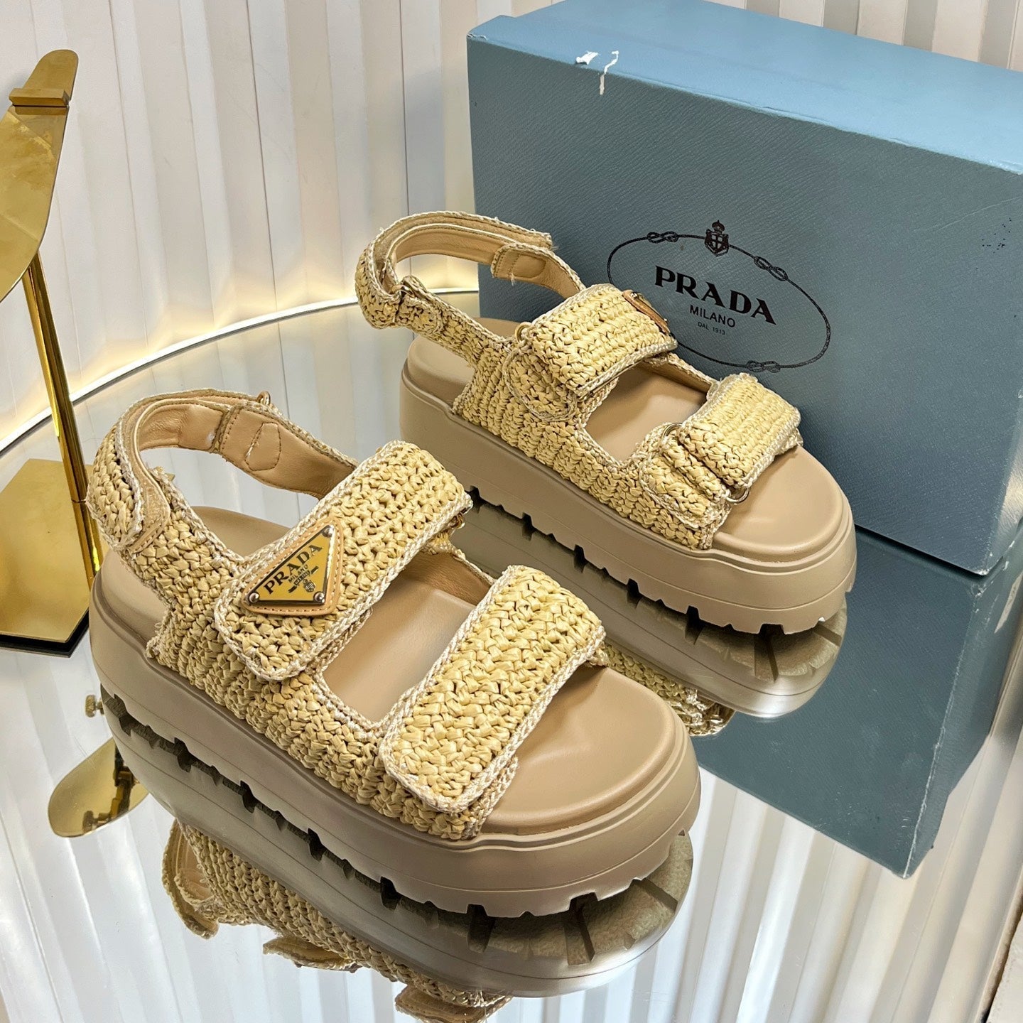 PRADA THICK-SOLED SLIDE IN BEIGE RAFFIA