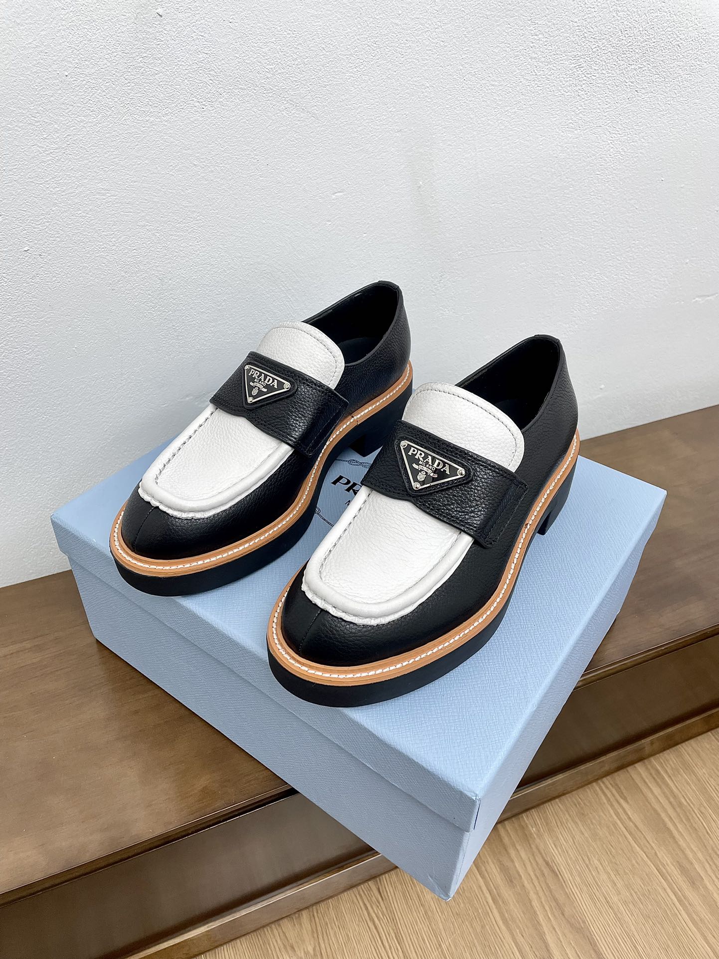 PRADA CHOCOLATE LOAFERS BLACK AND WHITE CALFSKIN