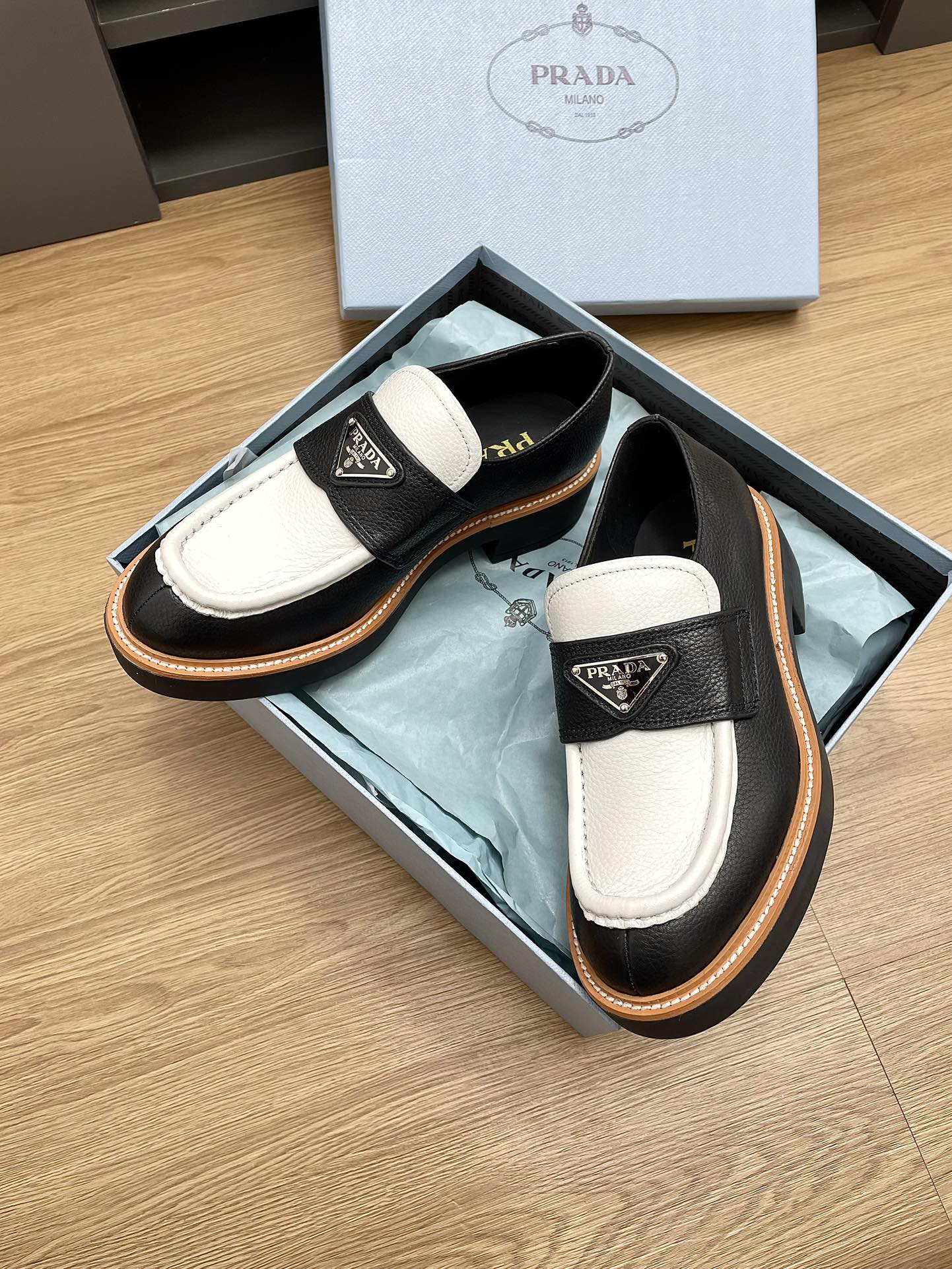PRADA CHOCOLATE LOAFERS BLACK AND WHITE CALFSKIN