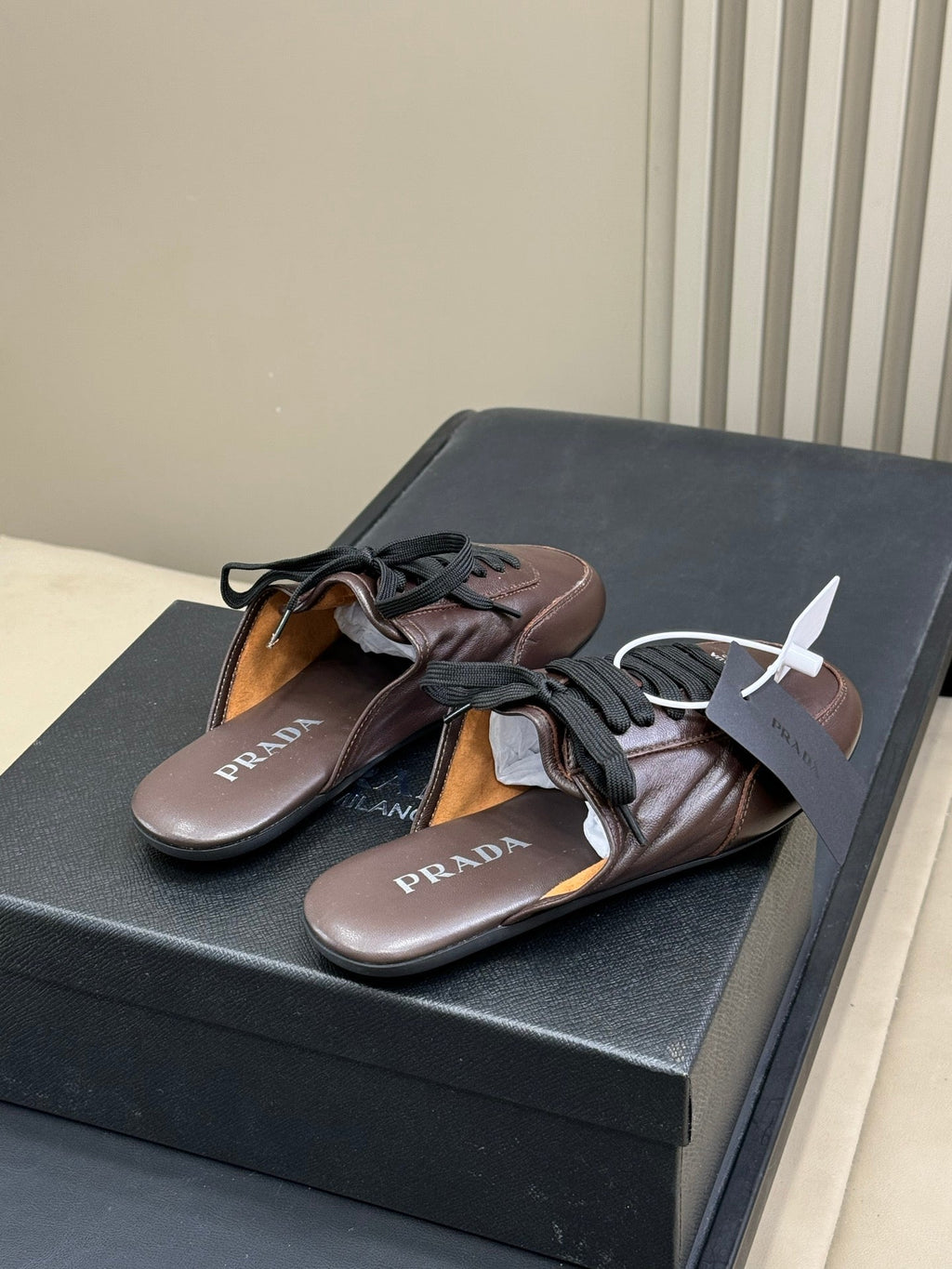 PRADA 25S COLLAPSE MULES IN RK BROWN CALFSKIN