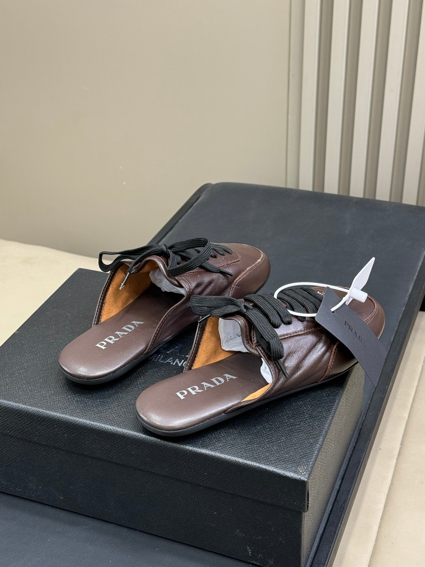 PRADA 25S COLLAPSE MULES IN RK BROWN CALFSKIN