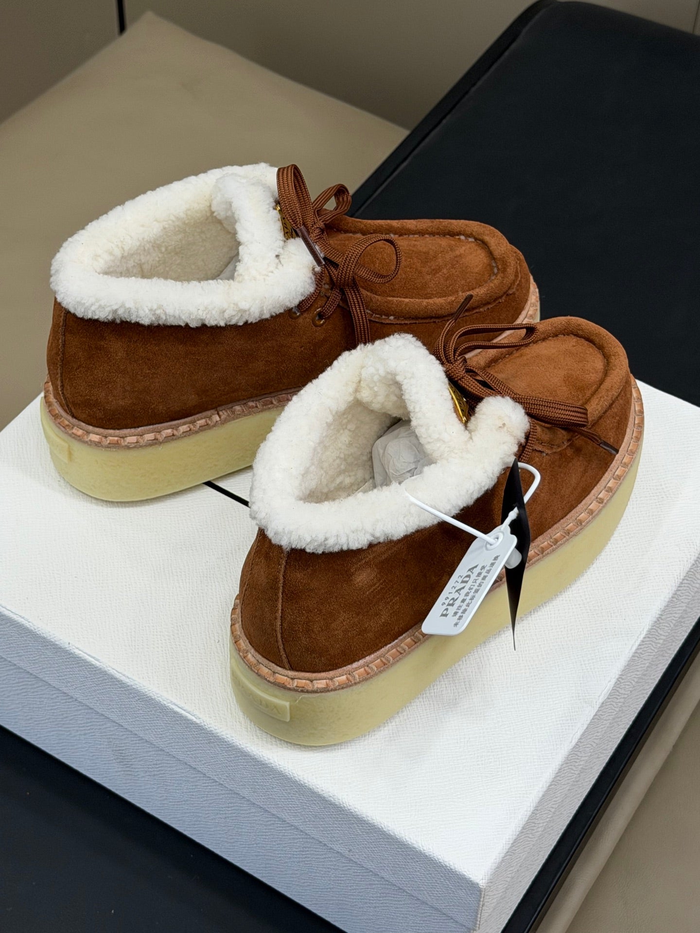 PRADA 25S HIGH-TOP SHOES 40 MM IN RK BROWN SUEDE SHEARLING-LINED