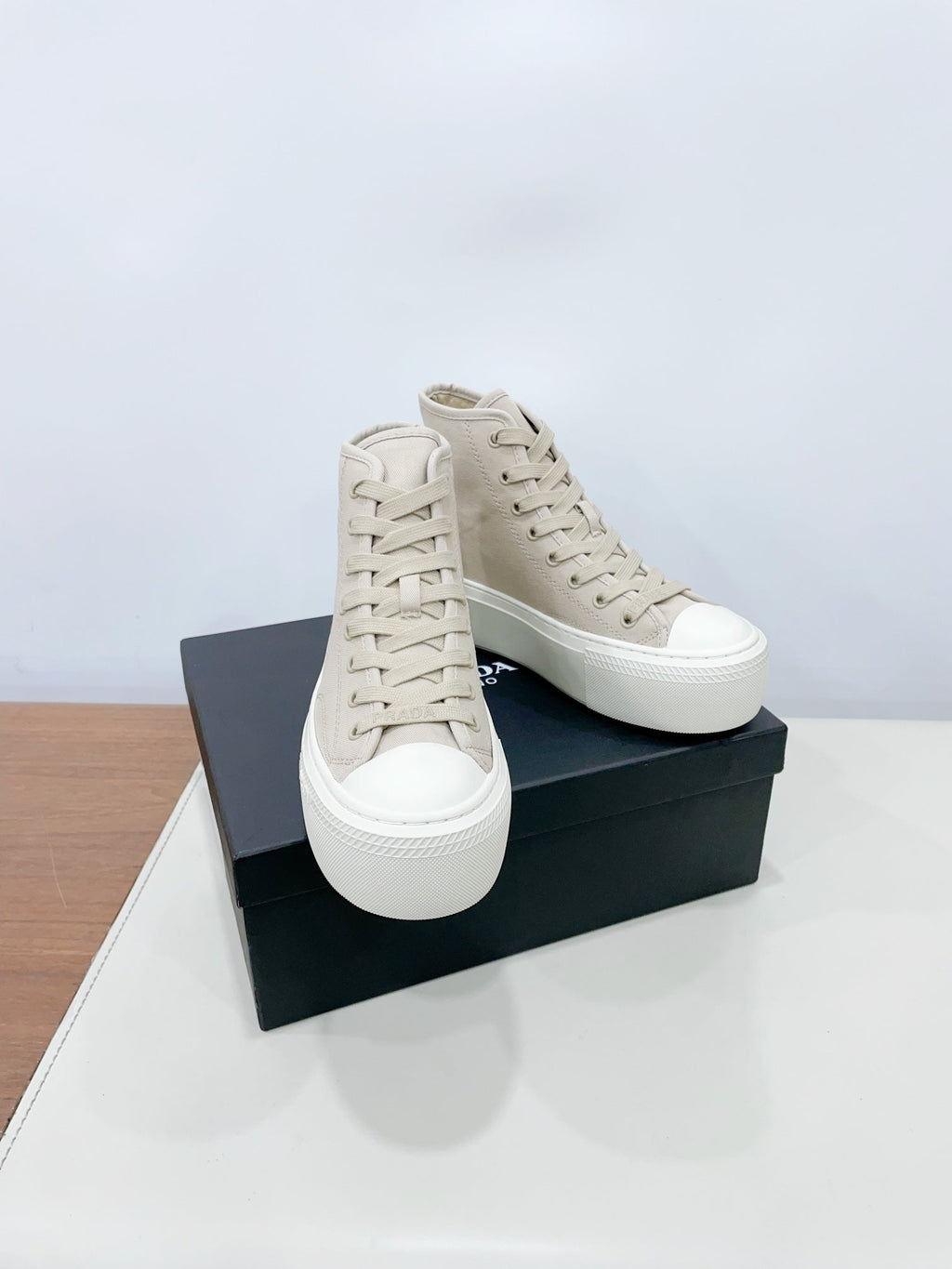 PRADA HIGH-TOP SEANKERS IN BEIGE CANVAS