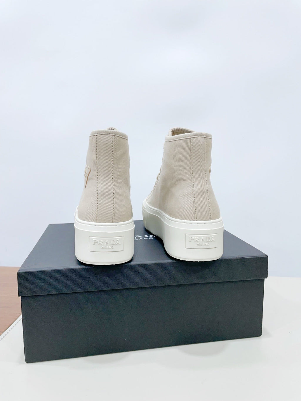 PRADA HIGH-TOP SEANKERS IN BEIGE CANVAS