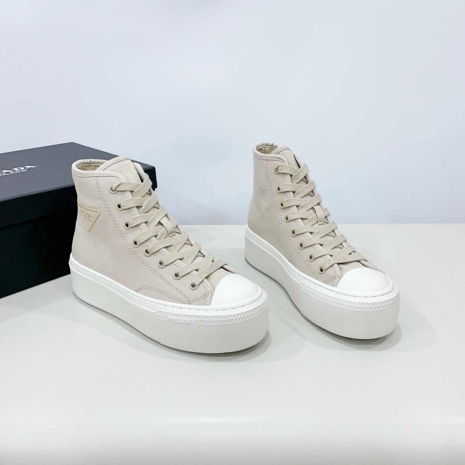 PRADA HIGH-TOP SEANKERS IN BEIGE CANVAS