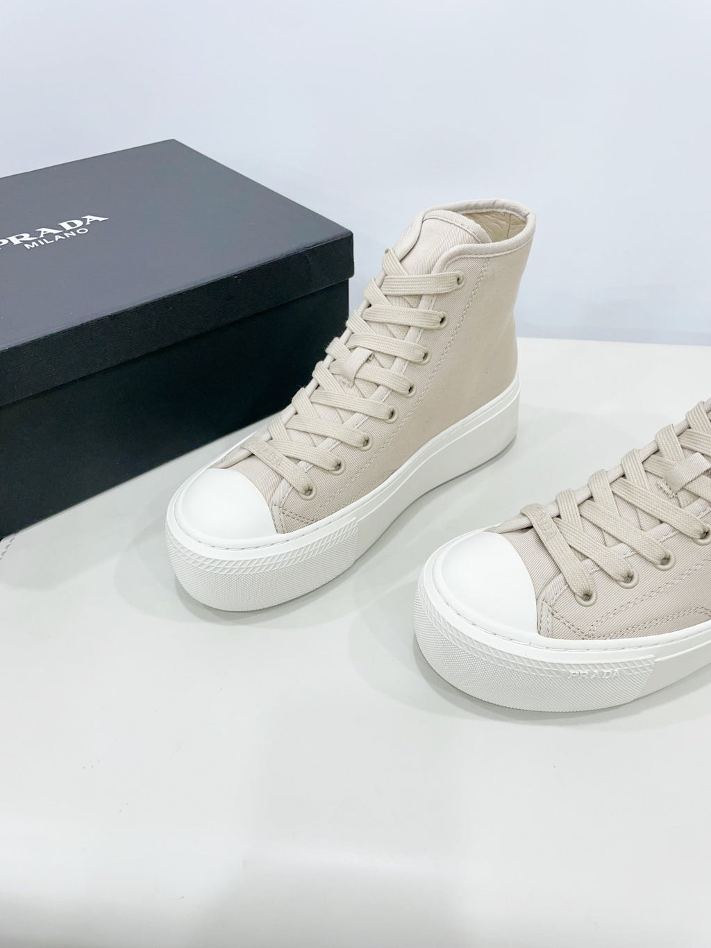 PRADA HIGH-TOP SEANKERS IN BEIGE CANVAS