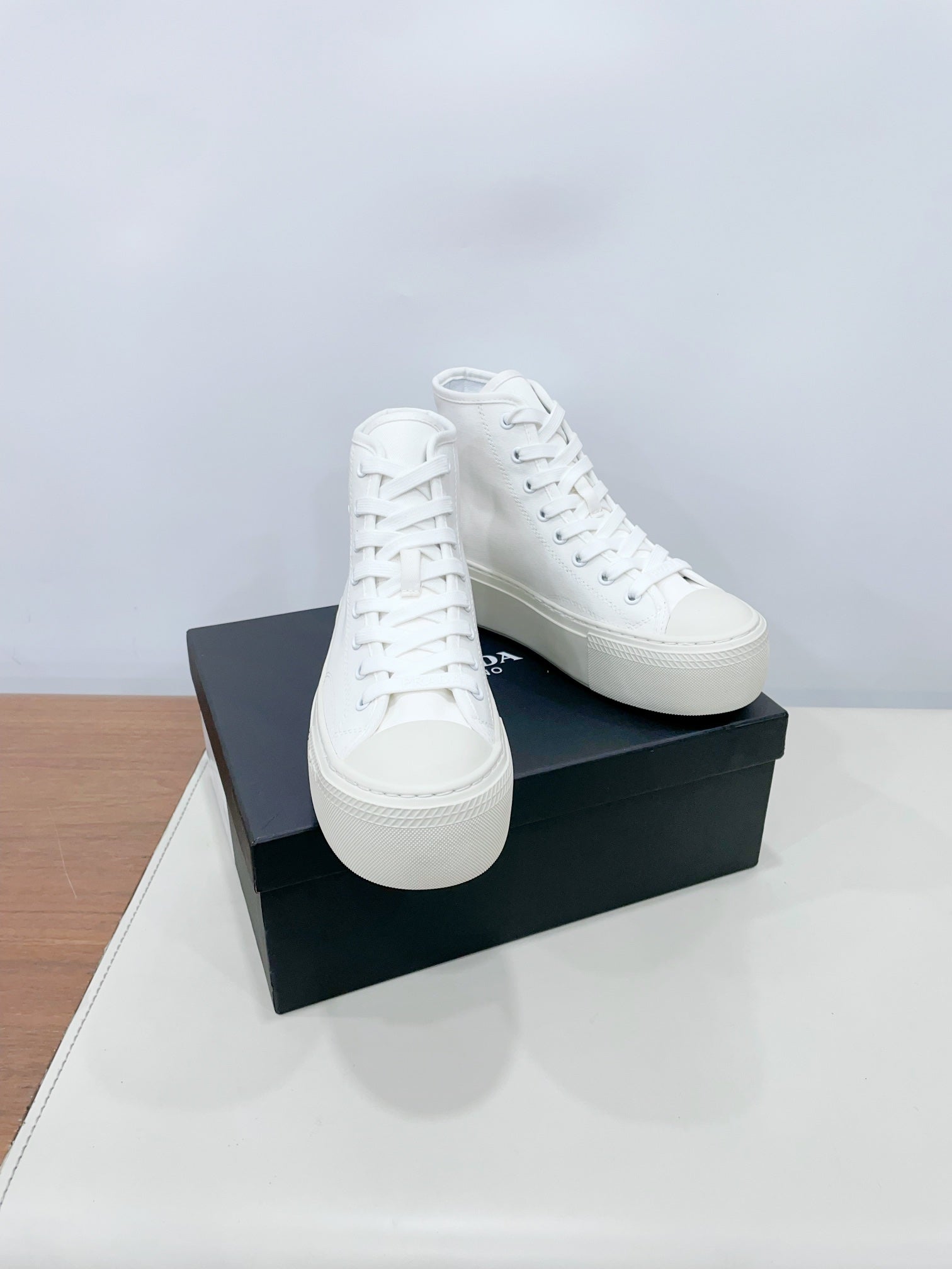 PRADA HIGH-TOP SEANKERS IN WHITE CANVAS