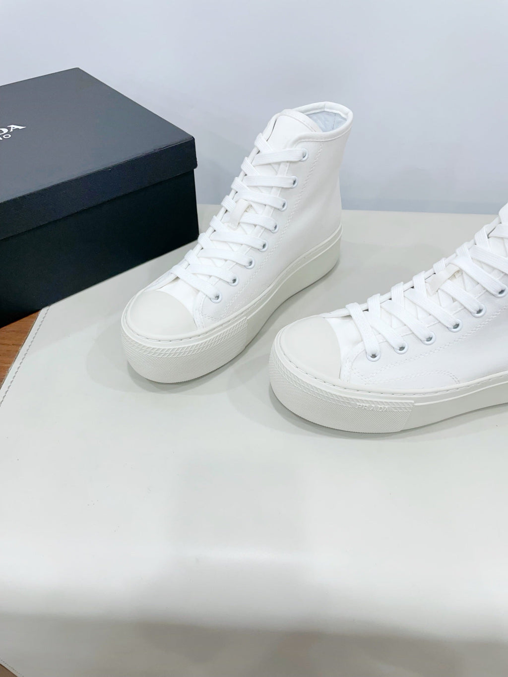 PRADA HIGH-TOP SEANKERS IN WHITE CANVAS