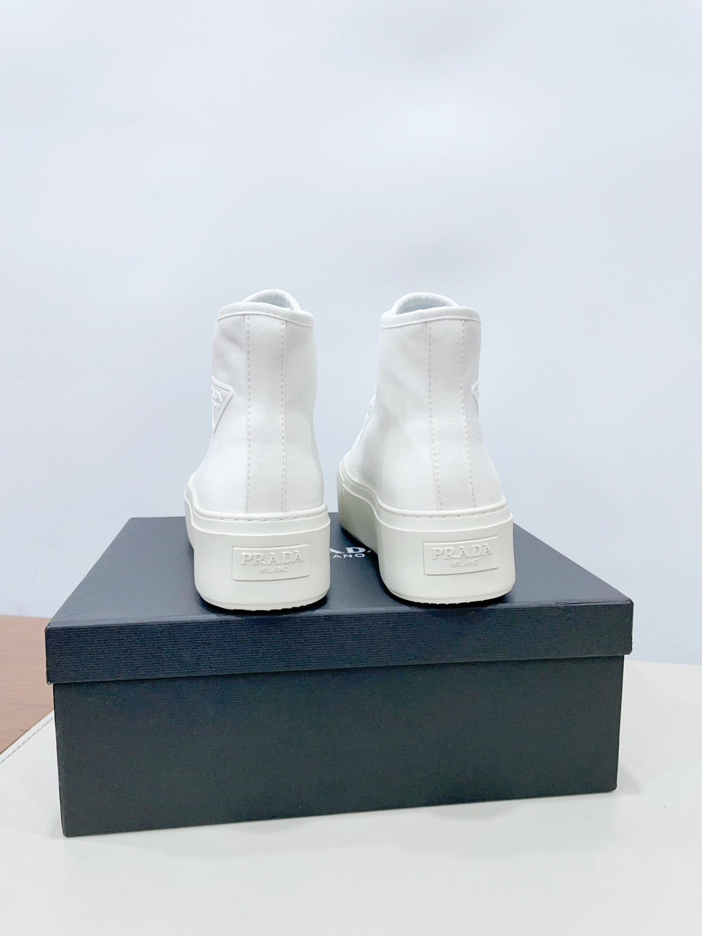PRADA HIGH-TOP SEANKERS IN WHITE CANVAS