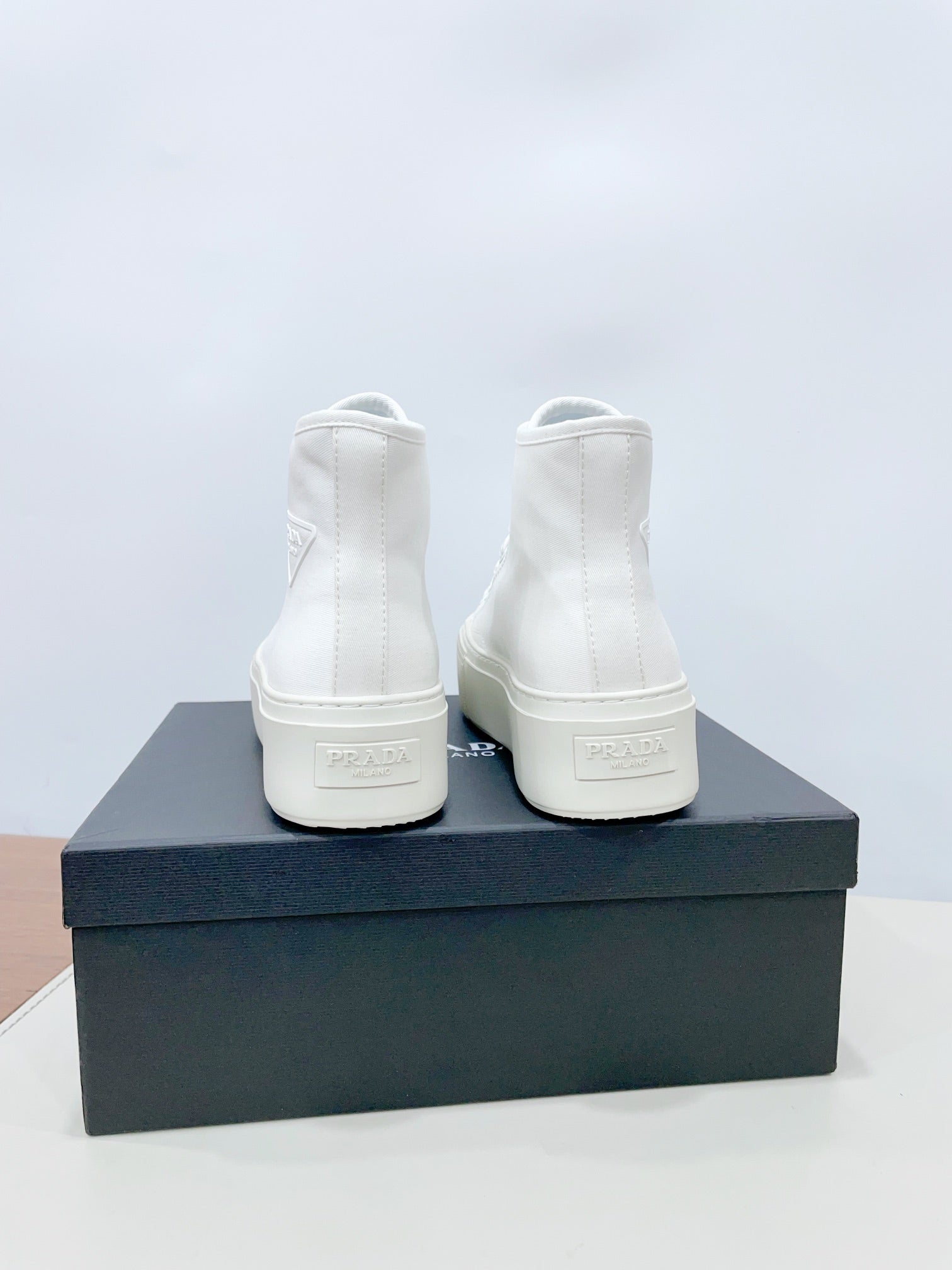 PRADA HIGH-TOP SEANKERS IN WHITE CANVAS