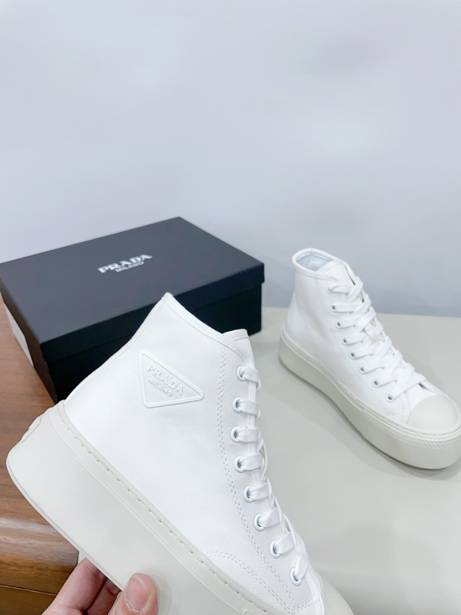 PRADA HIGH-TOP SEANKERS IN WHITE CANVAS