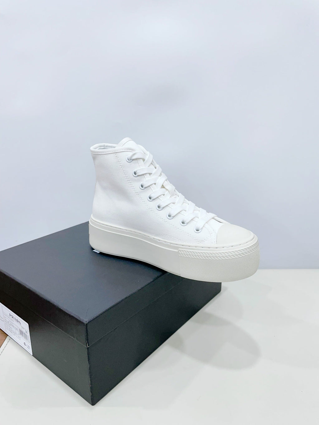 PRADA HIGH-TOP SEANKERS IN WHITE CANVAS