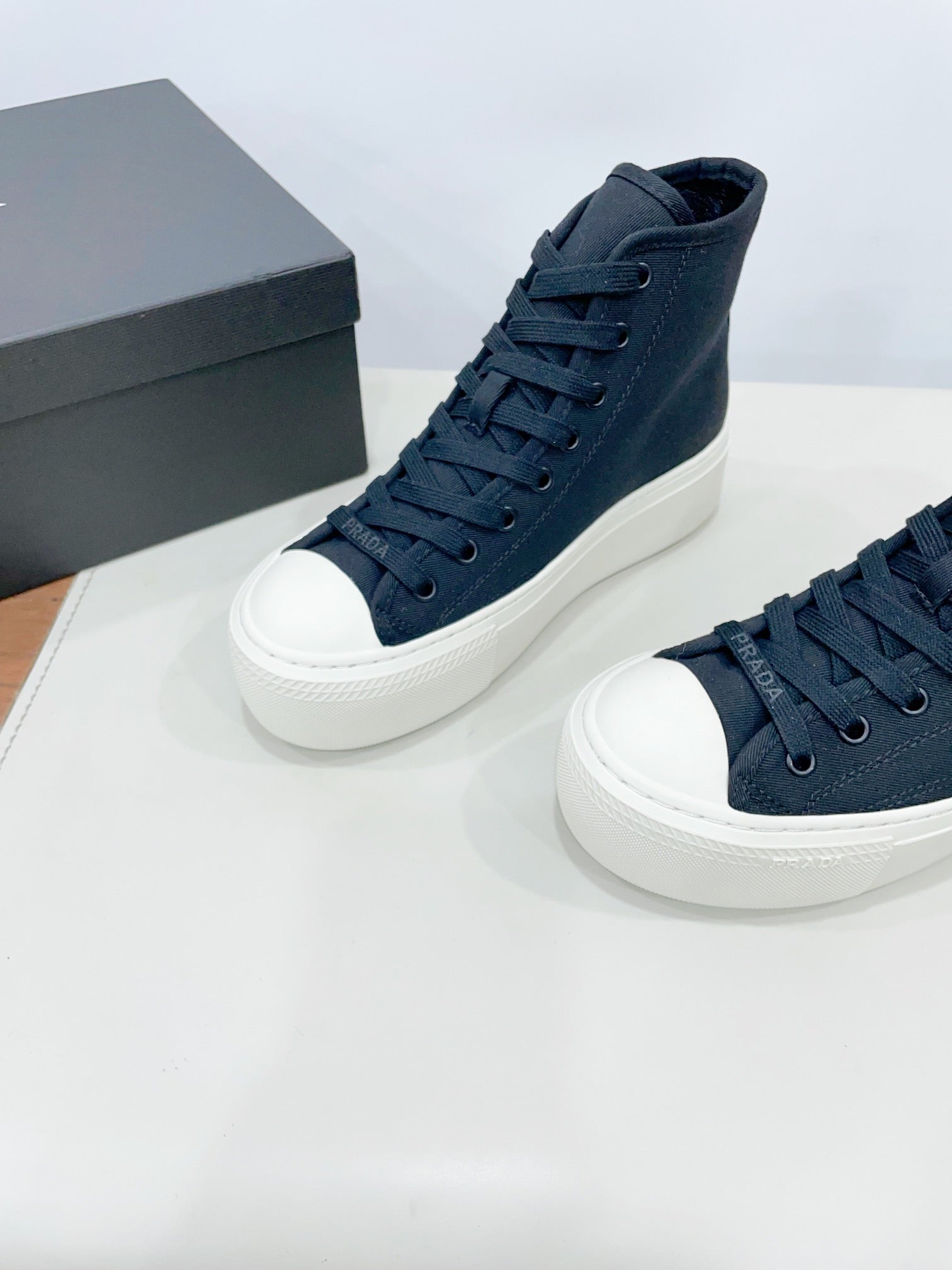 PRADA HIGH-TOP SEANKERS IN SPACE BLUE CANVAS