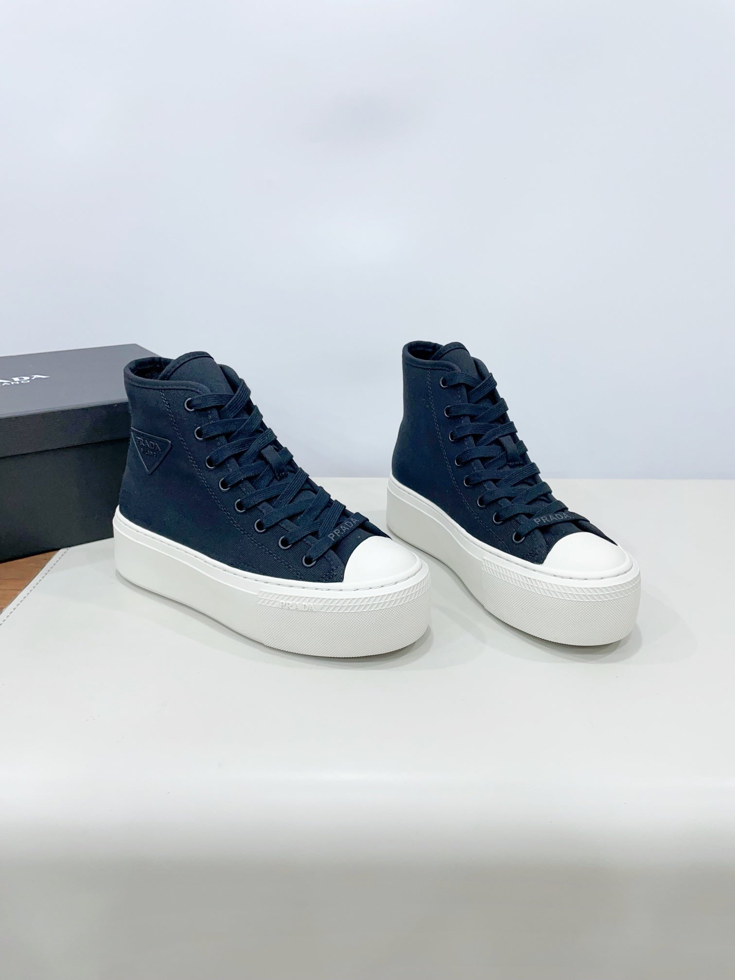 PRADA HIGH-TOP SEANKERS IN SPACE BLUE CANVAS