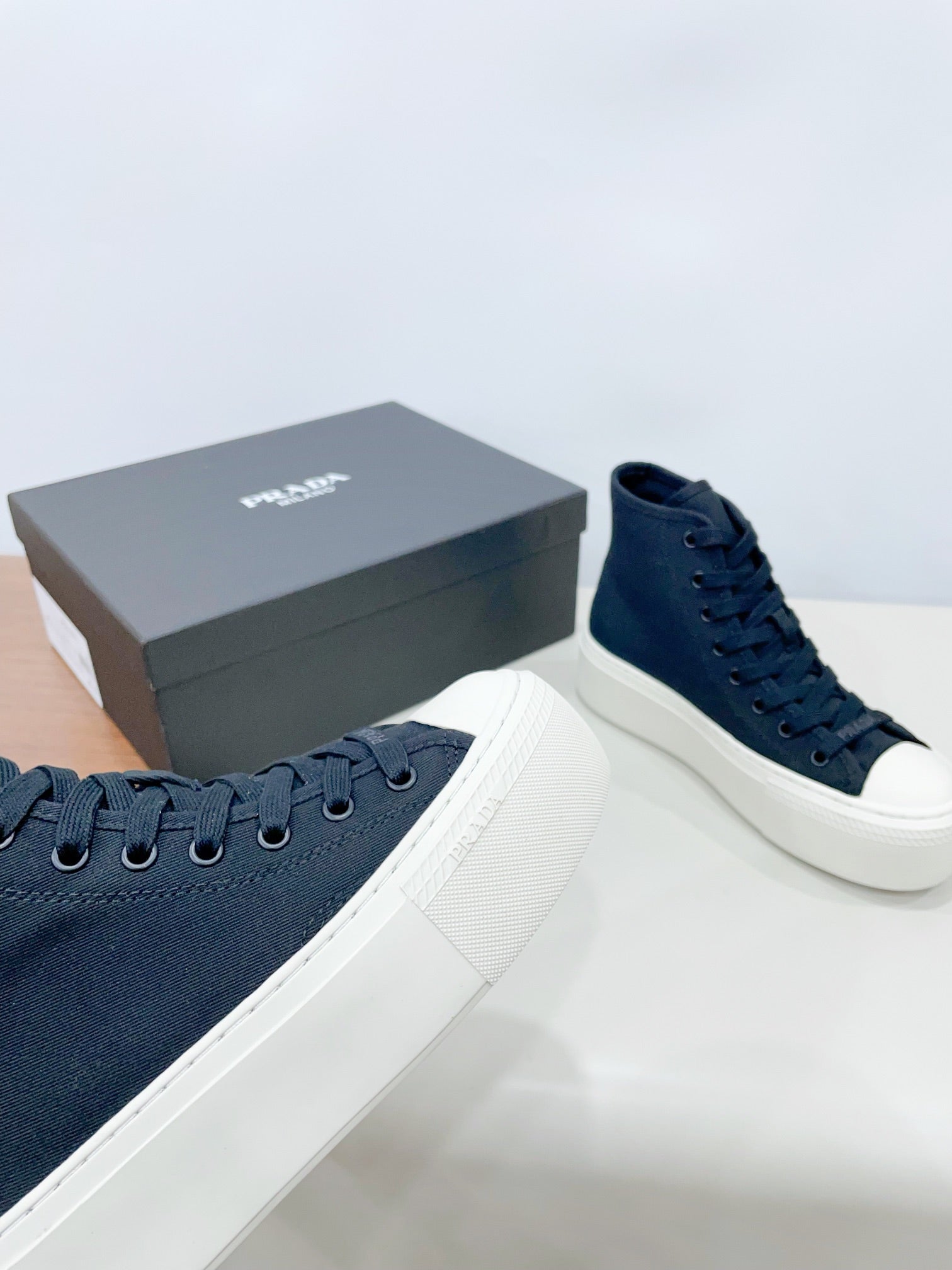 PRADA HIGH-TOP SEANKERS IN SPACE BLUE CANVAS