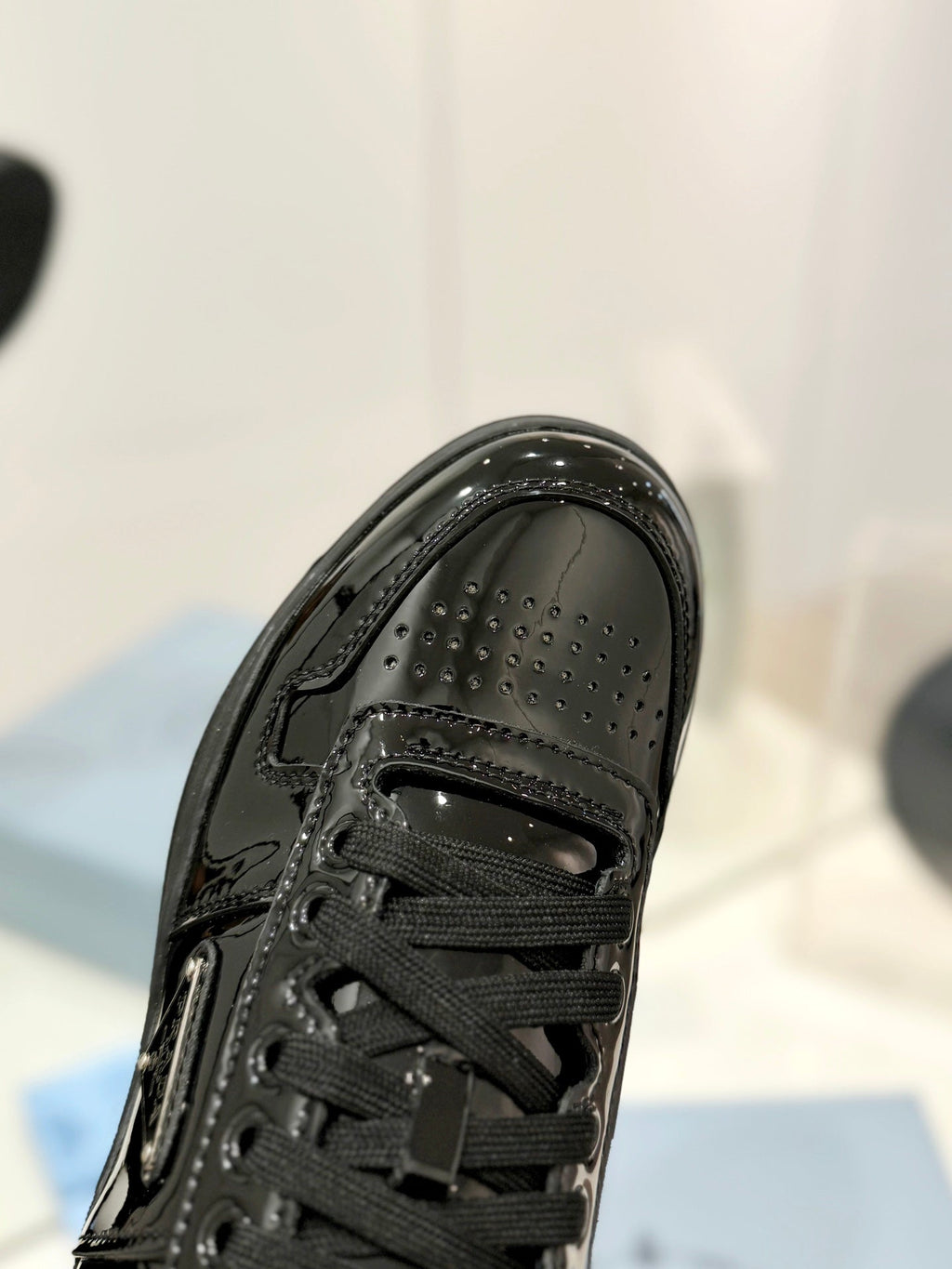 PRADA DOWNTOWN PERFORATED SNEAKERS GLOSSY BLACK CALFSKIN