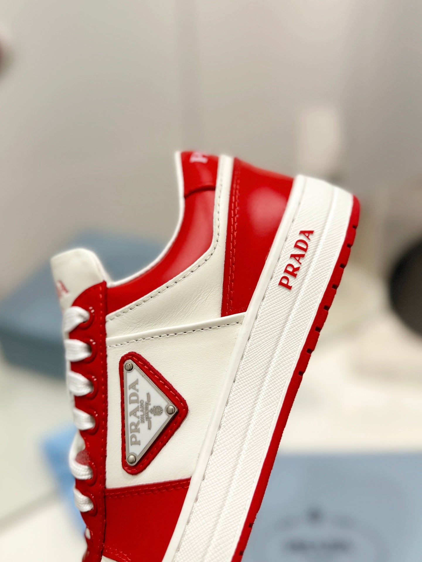 PRADA DOWNTOWN PERFORATED SNEAKERS WHITE AND RED CALFSKIN