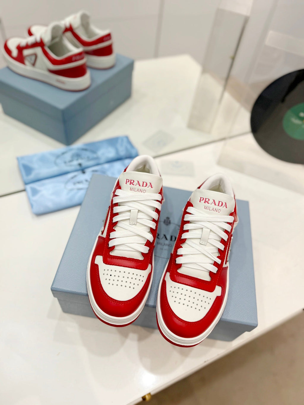 PRADA DOWNTOWN PERFORATED SNEAKERS WHITE AND RED CALFSKIN