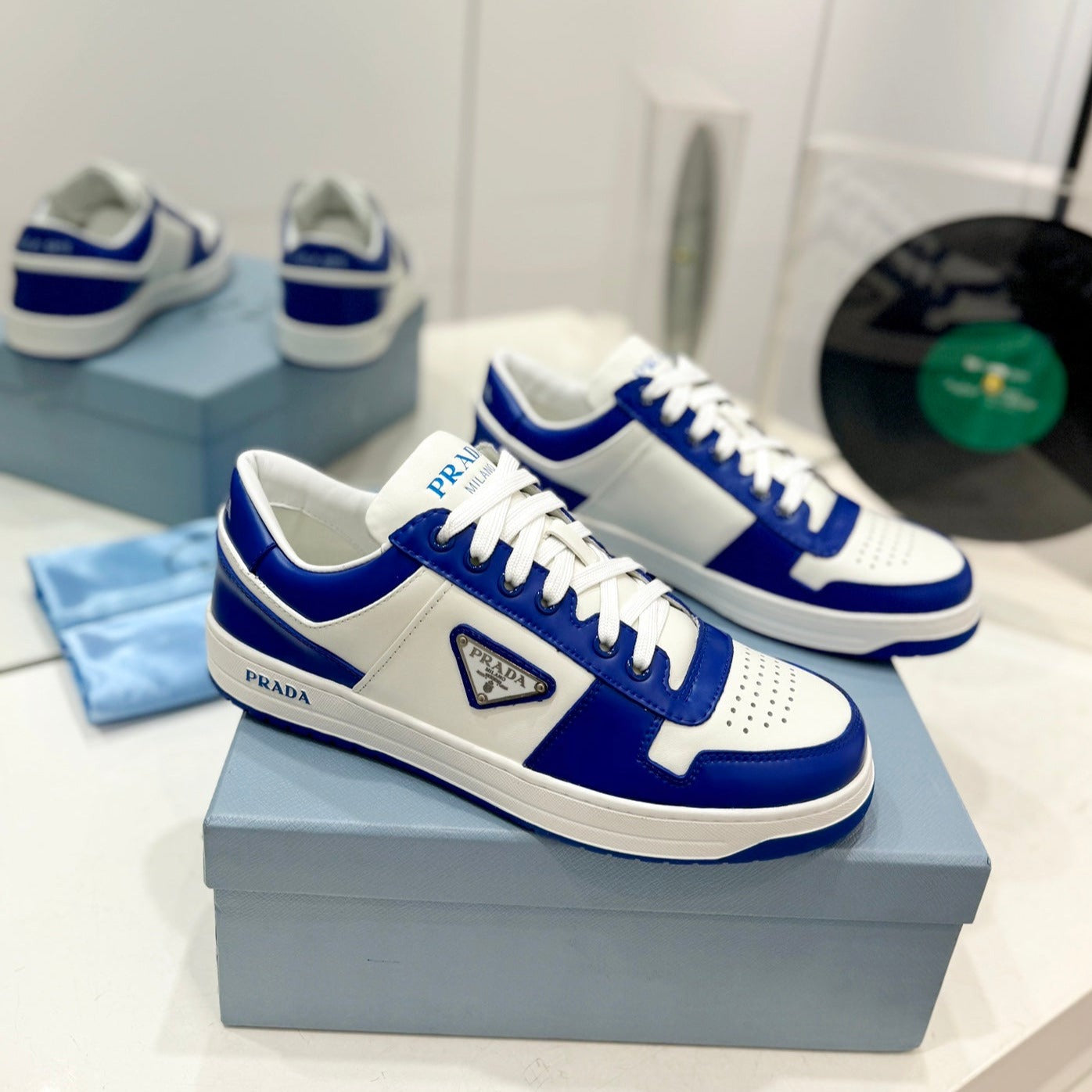PRADA DOWNTOWN PERFORATED SNEAKERS WHITE AND COBALT CALFSKIN
