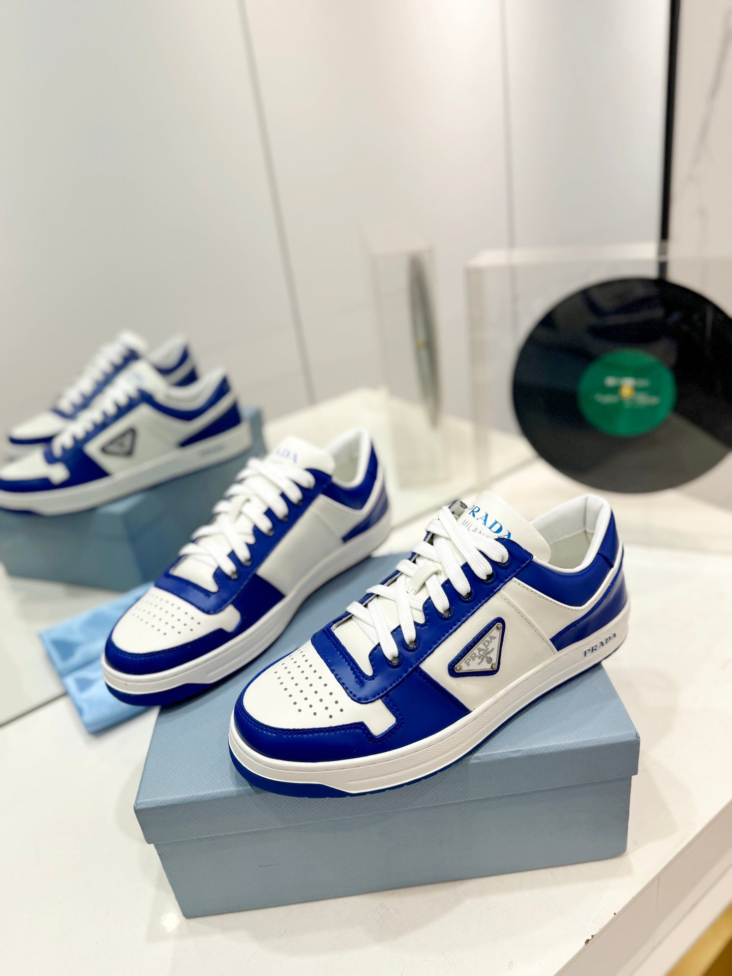 PRADA DOWNTOWN PERFORATED SNEAKERS WHITE AND COBALT CALFSKIN