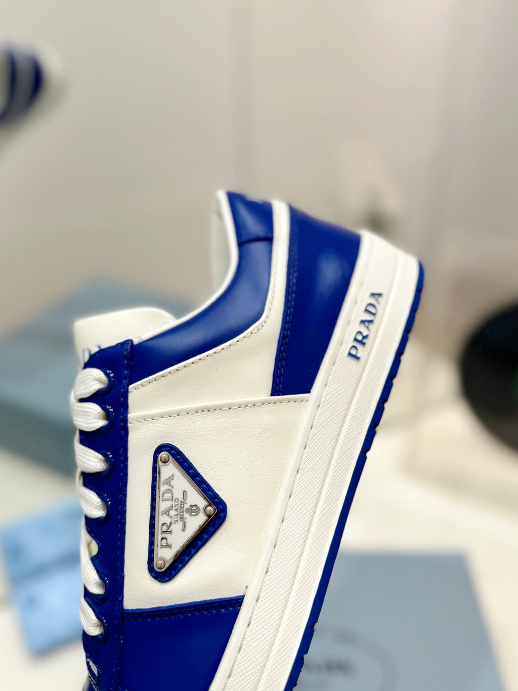 PRADA DOWNTOWN PERFORATED SNEAKERS WHITE AND COBALT CALFSKIN