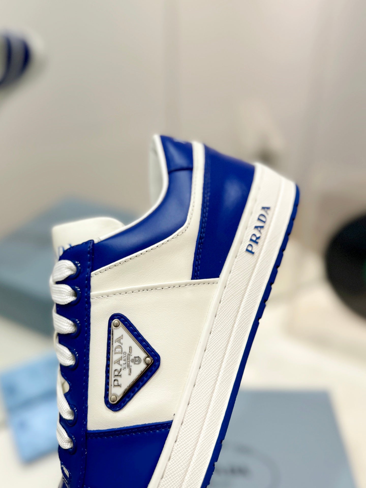 PRADA DOWNTOWN PERFORATED SNEAKERS WHITE AND COBALT CALFSKIN
