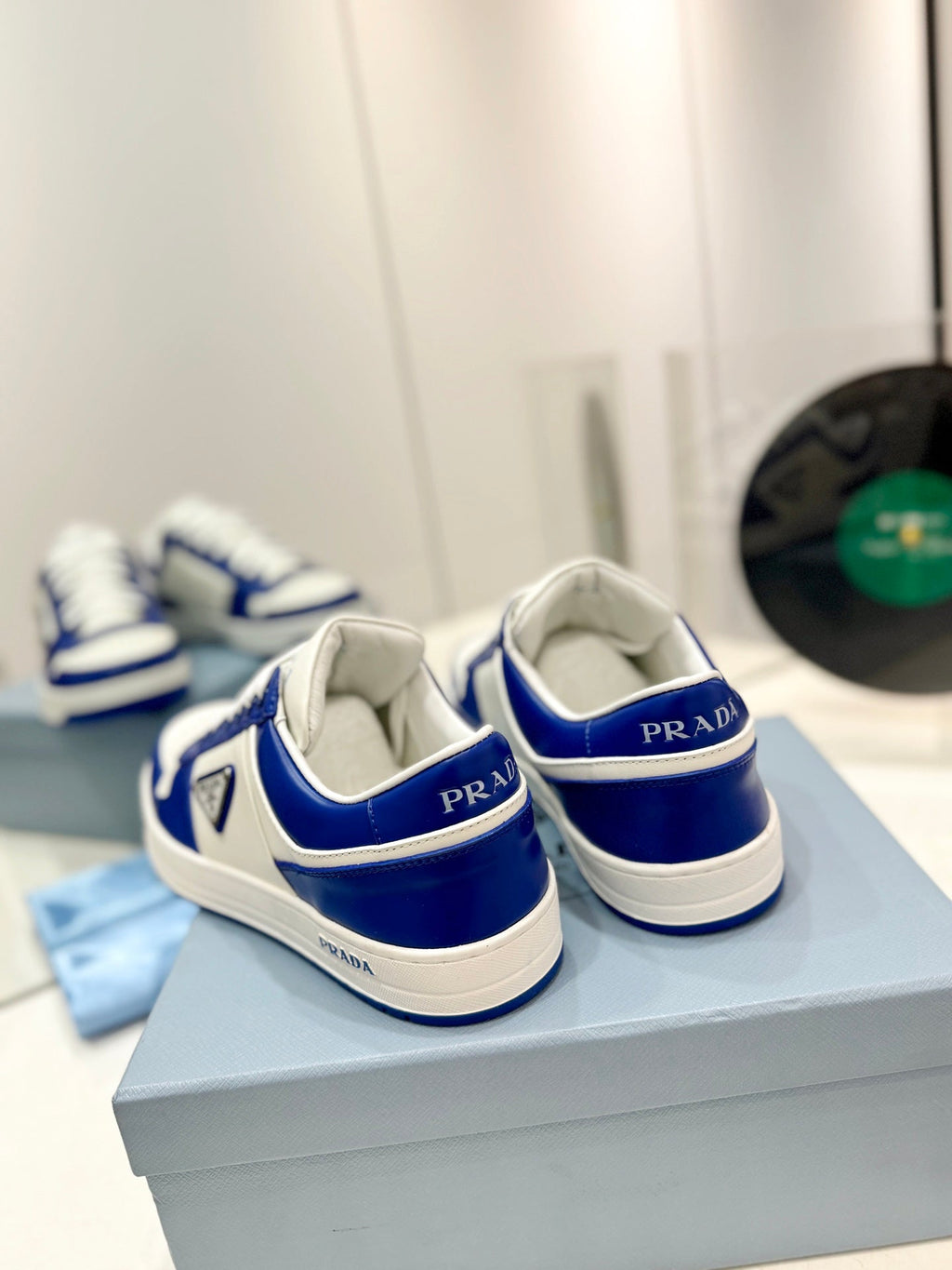 PRADA DOWNTOWN PERFORATED SNEAKERS WHITE AND COBALT CALFSKIN