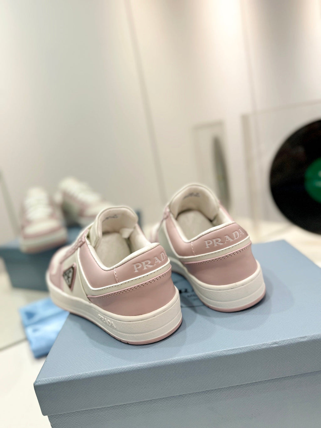 PRADA DOWNTOWN PERFORATED SNEAKERS WHITE AND BLUSH CALFSKIN