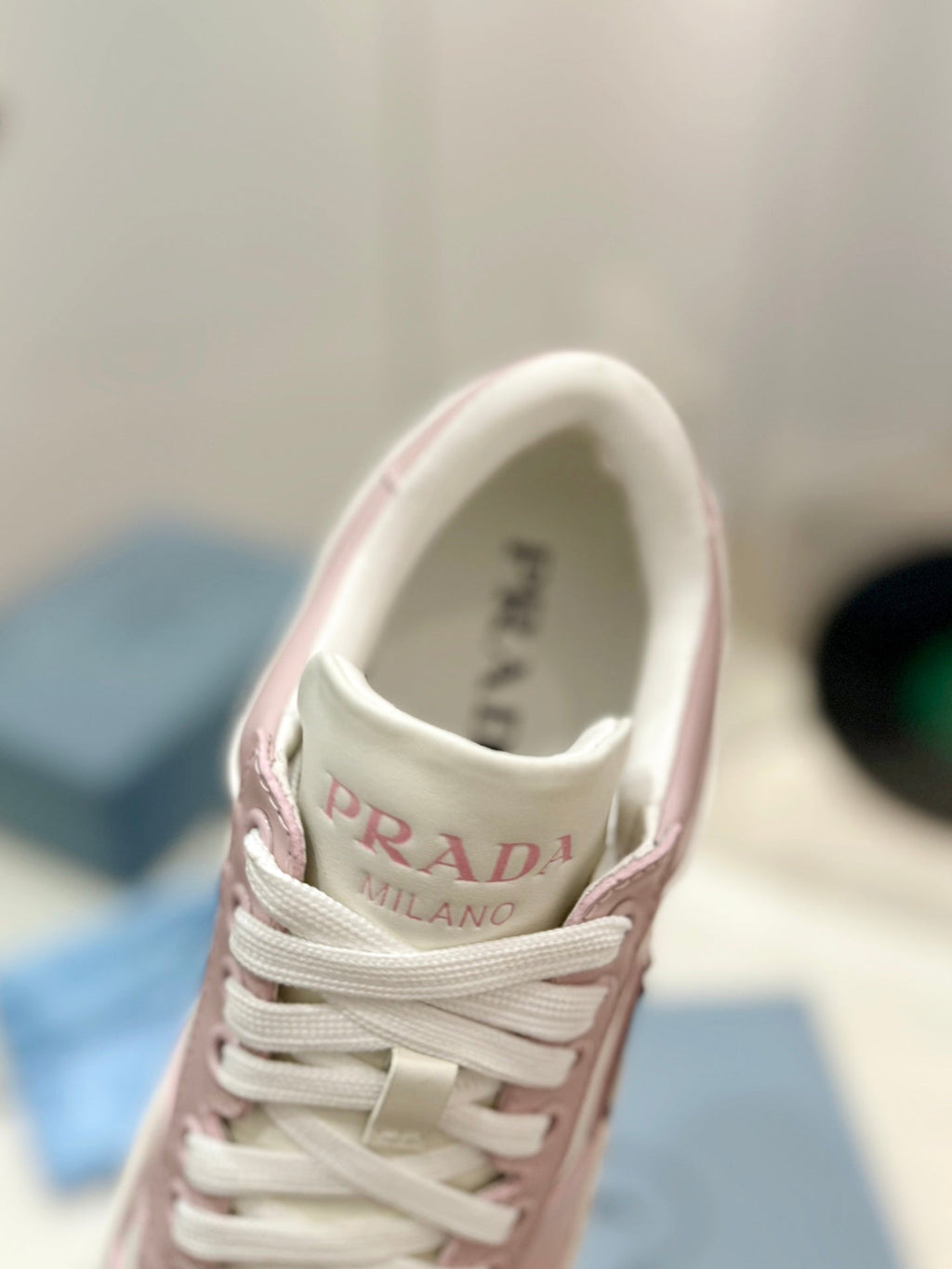 PRADA DOWNTOWN PERFORATED SNEAKERS WHITE AND BLUSH CALFSKIN