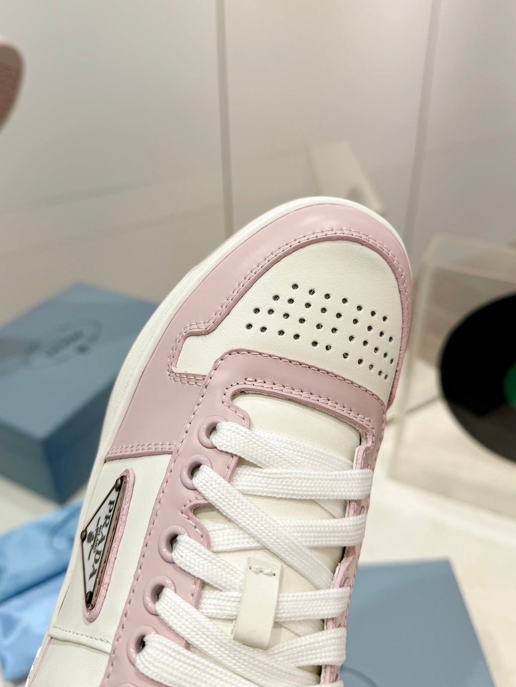 PRADA DOWNTOWN PERFORATED SNEAKERS WHITE AND BLUSH CALFSKIN