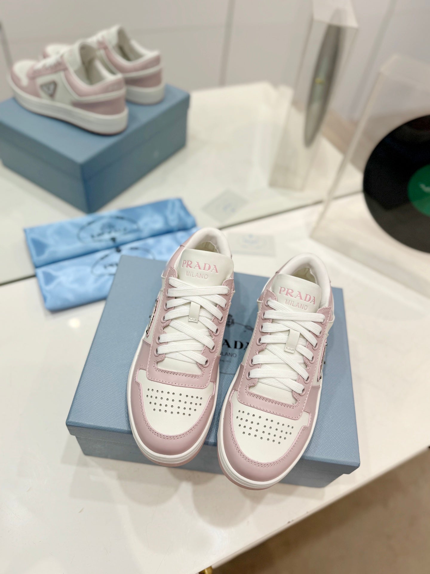 PRADA DOWNTOWN PERFORATED SNEAKERS WHITE AND BLUSH CALFSKIN