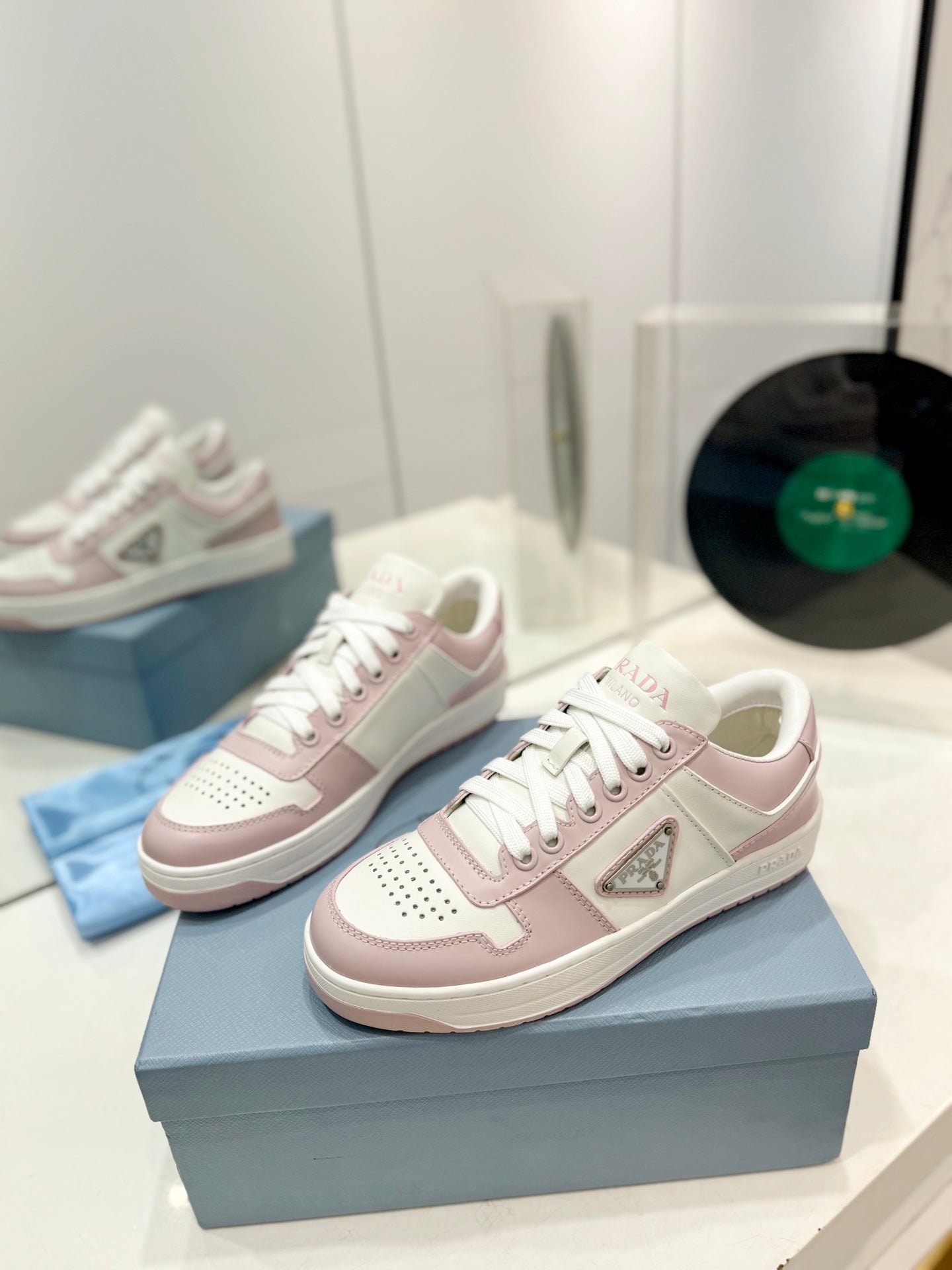 PRADA DOWNTOWN PERFORATED SNEAKERS WHITE AND BLUSH CALFSKIN