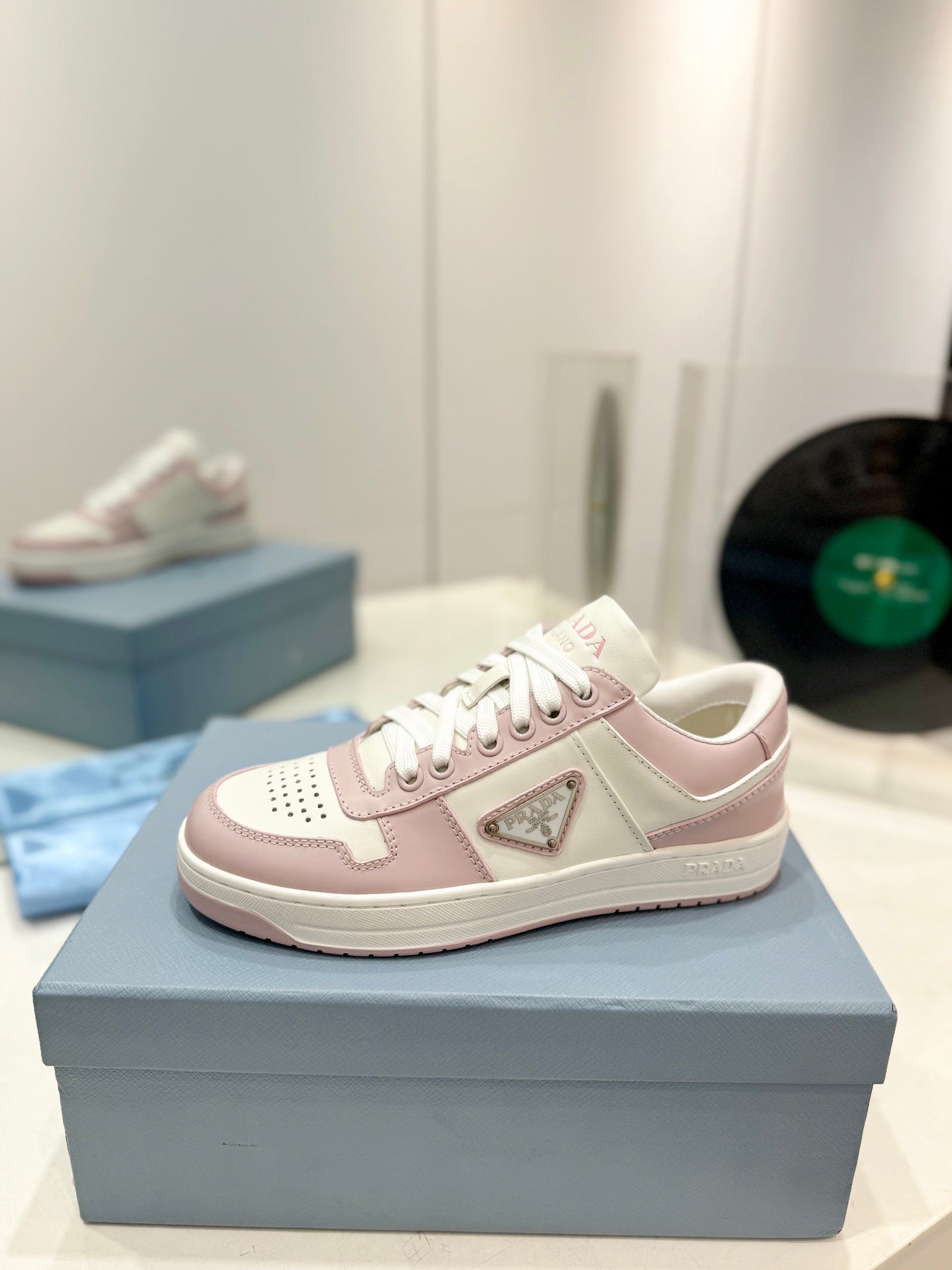 PRADA DOWNTOWN PERFORATED SNEAKERS WHITE AND BLUSH CALFSKIN