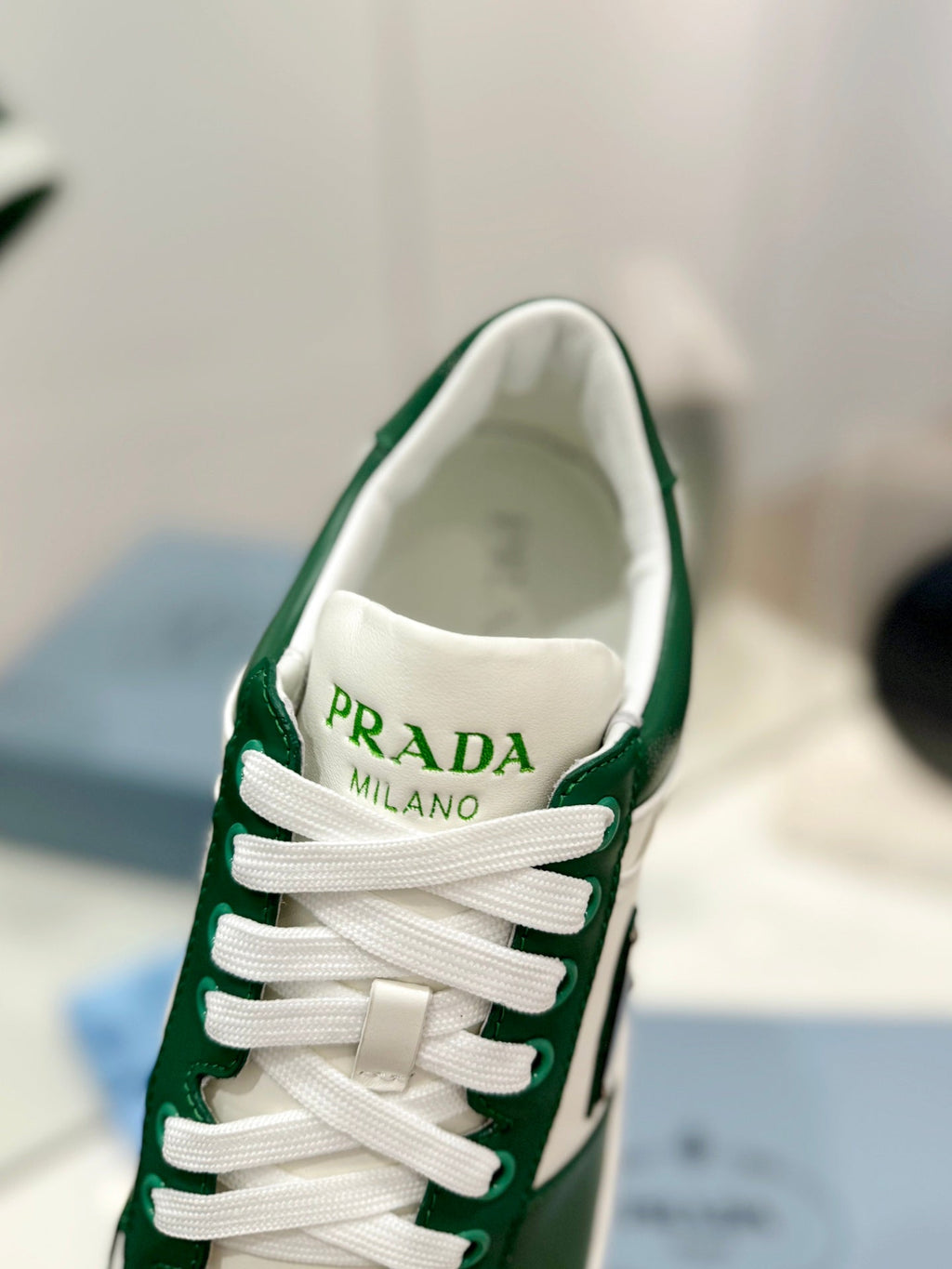 PRADA DOWNTOWN PERFORATED SNEAKERS WHITE AND GREEN CALFSKIN