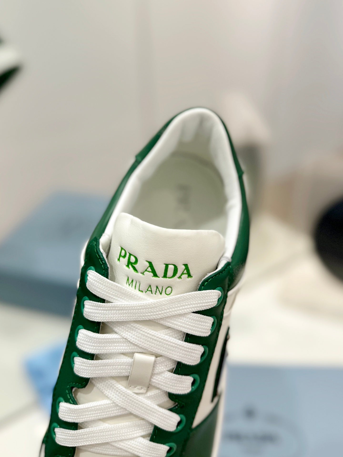 PRADA DOWNTOWN PERFORATED SNEAKERS WHITE AND GREEN CALFSKIN