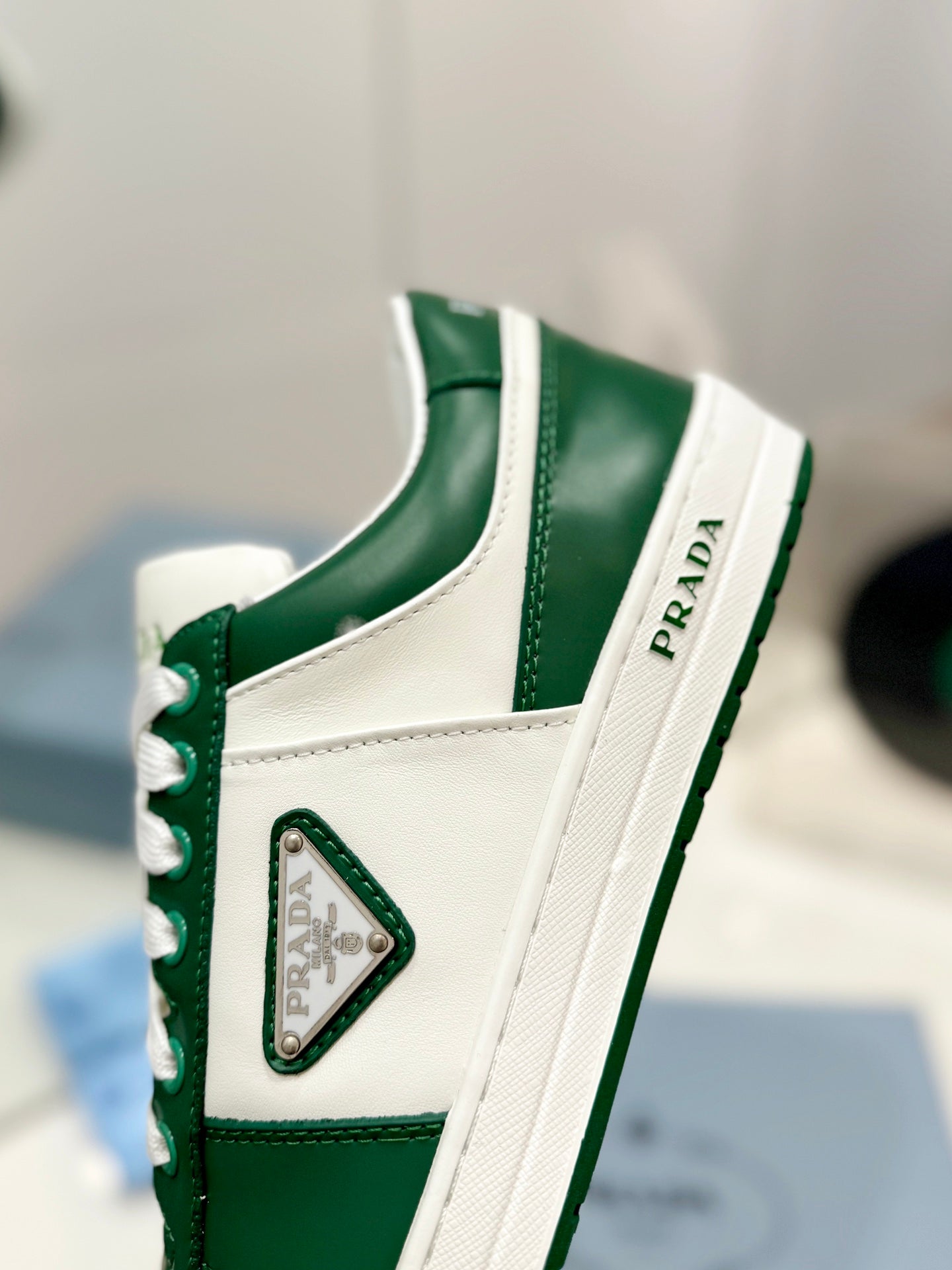 PRADA DOWNTOWN PERFORATED SNEAKERS WHITE AND GREEN CALFSKIN