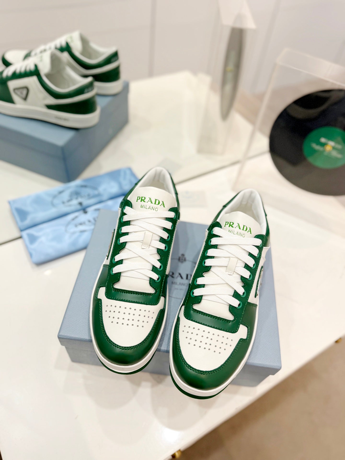 PRADA DOWNTOWN PERFORATED SNEAKERS WHITE AND GREEN CALFSKIN