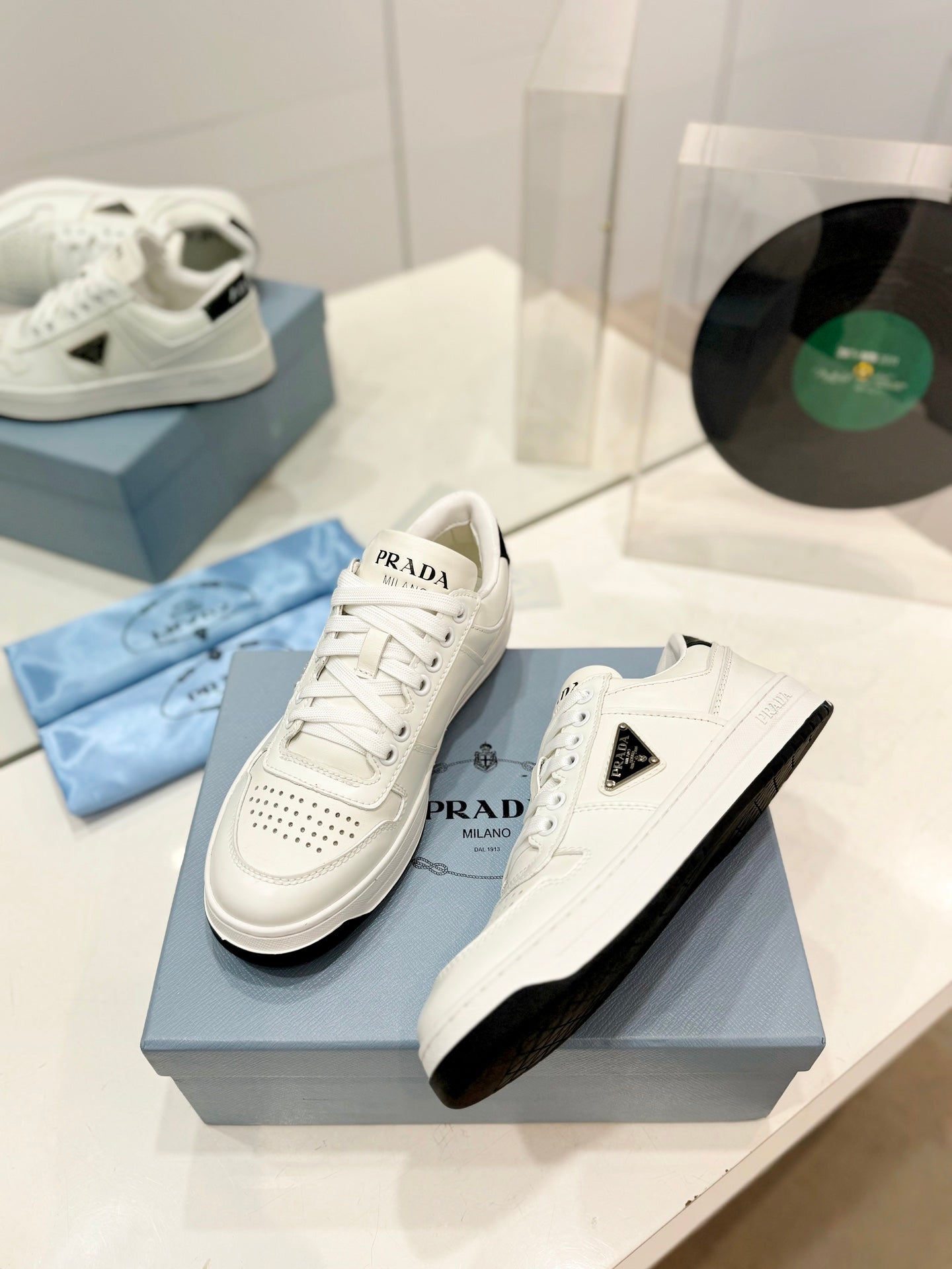 PRADA DOWNTOWN PERFORATED SNEAKERS WHITE AND BLACK LOGO CALFSKIN