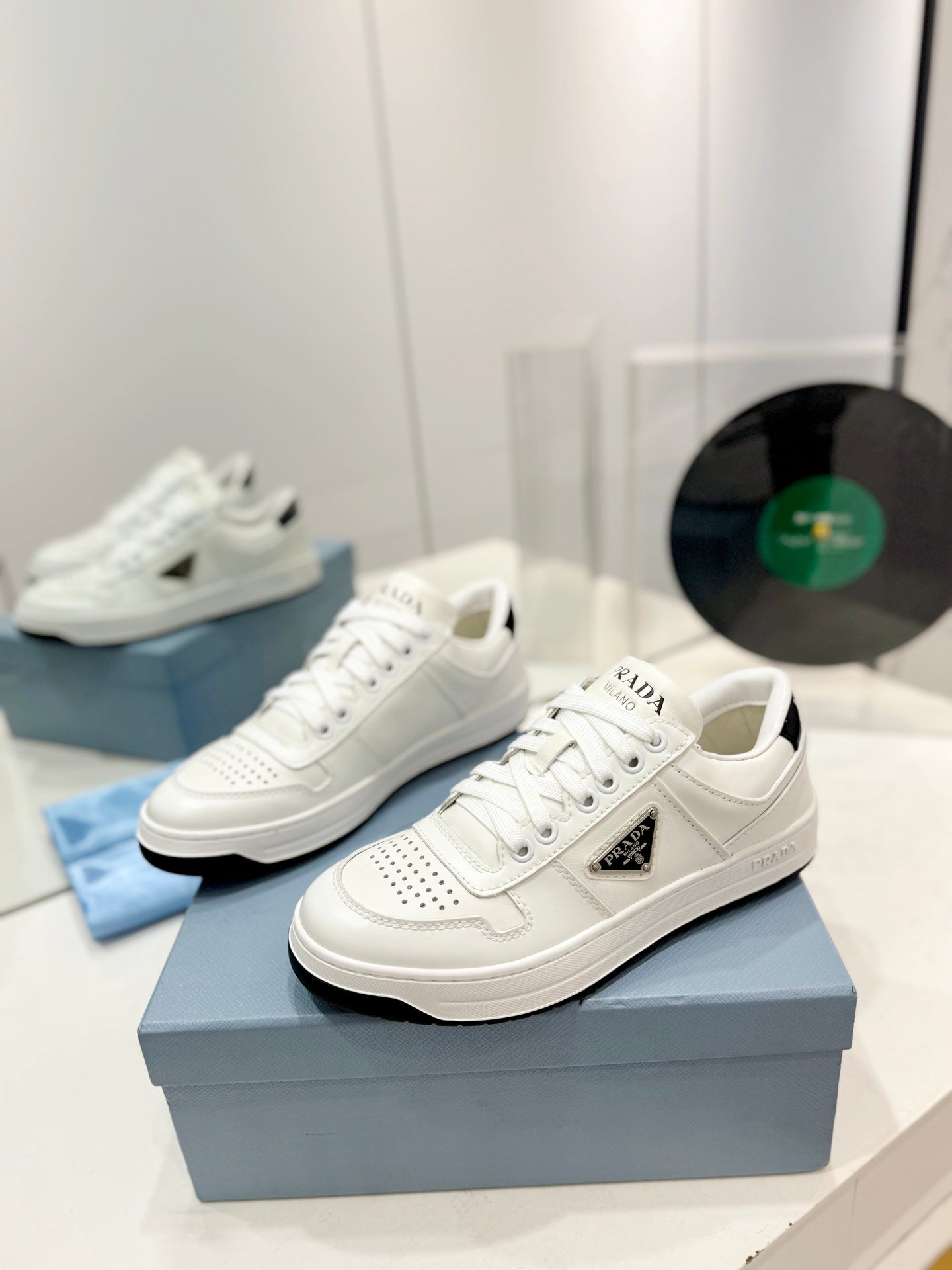 PRADA DOWNTOWN PERFORATED SNEAKERS WHITE AND BLACK LOGO CALFSKIN