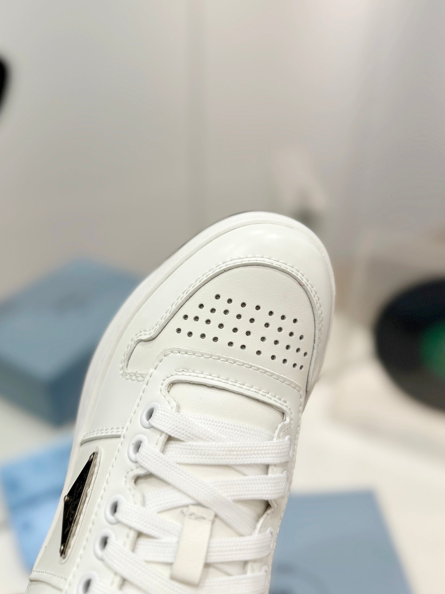 PRADA DOWNTOWN PERFORATED SNEAKERS WHITE AND BLACK LOGO CALFSKIN