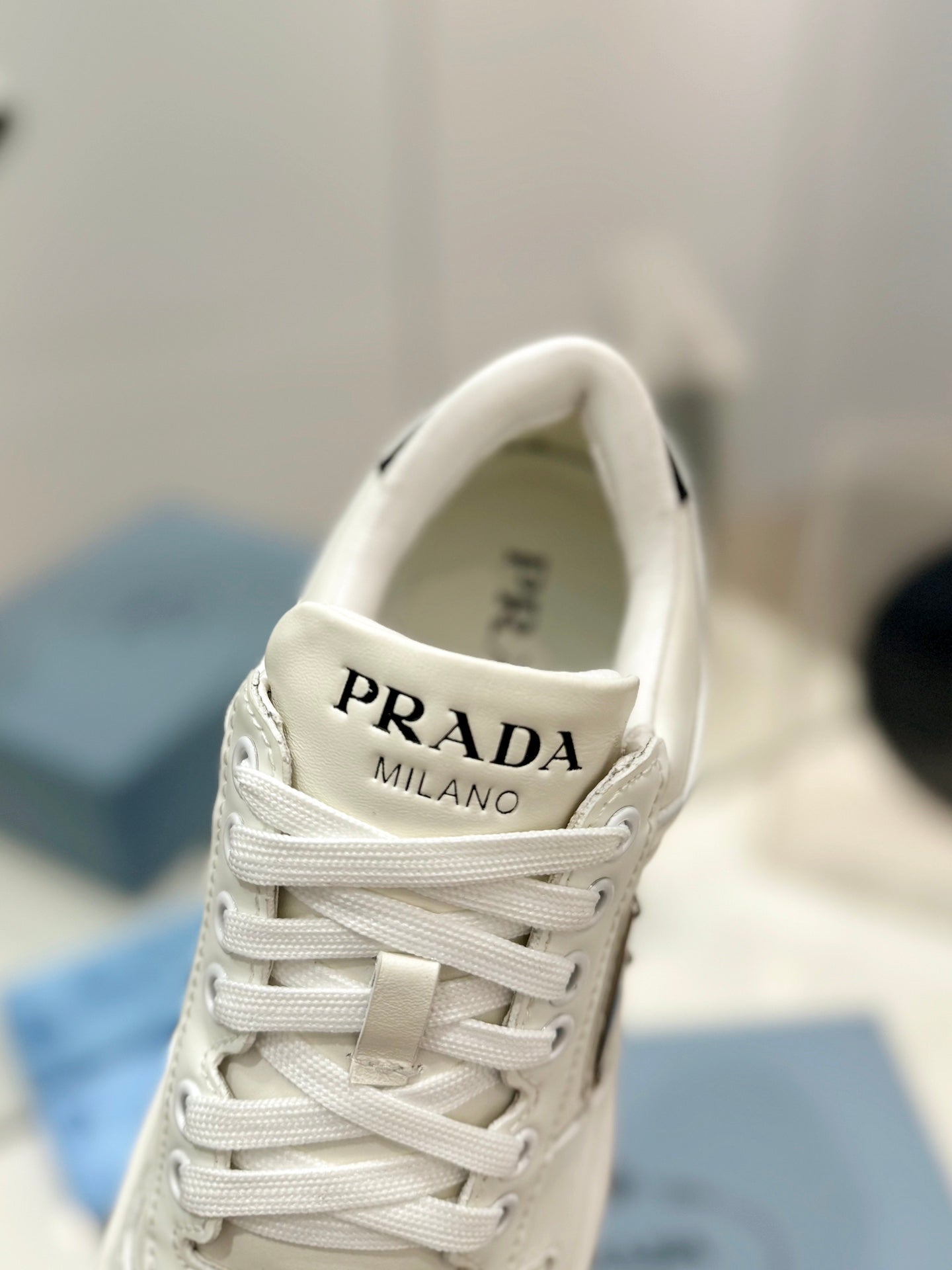 PRADA DOWNTOWN PERFORATED SNEAKERS WHITE AND BLACK LOGO CALFSKIN