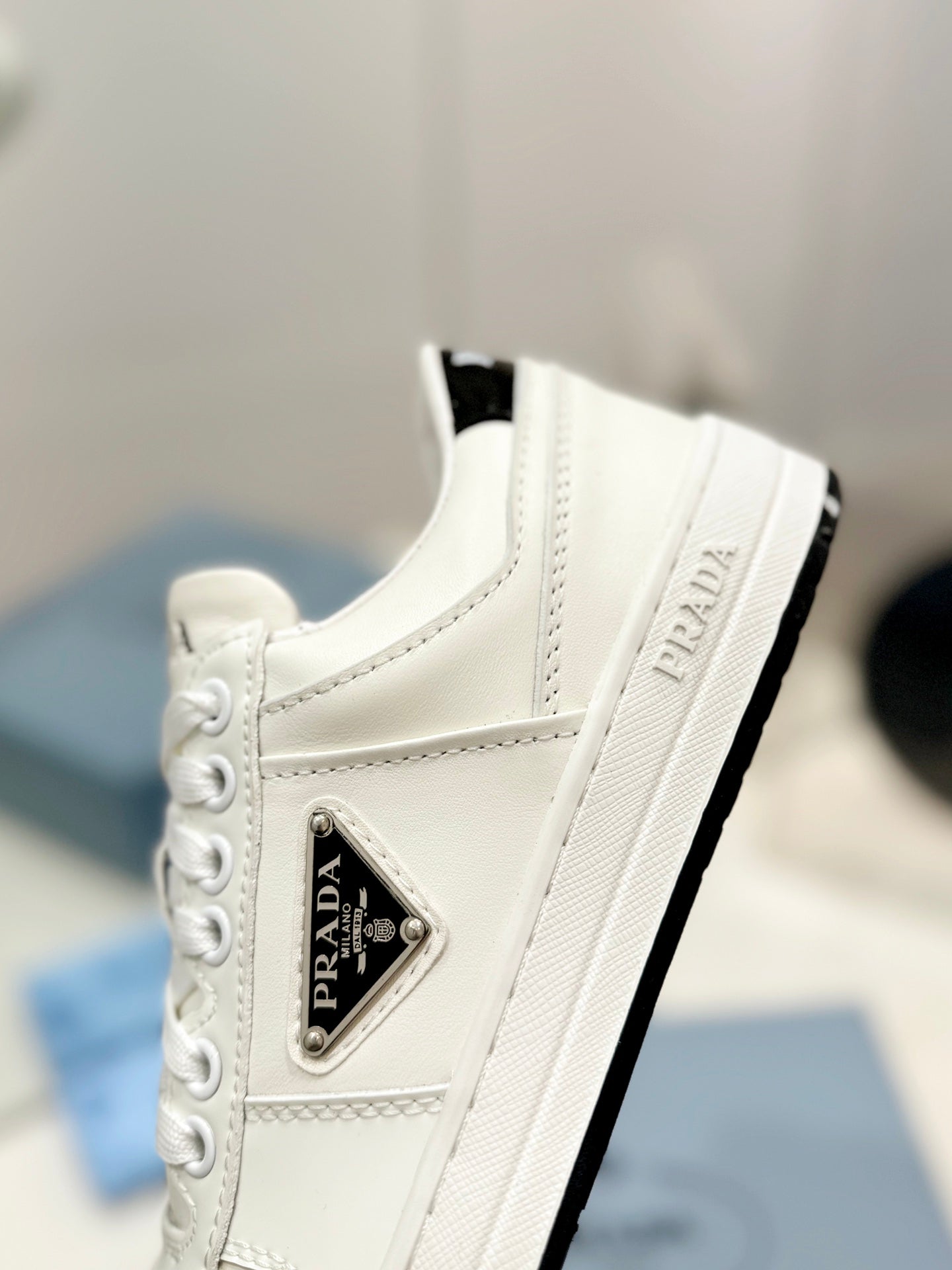 PRADA DOWNTOWN PERFORATED SNEAKERS WHITE AND BLACK LOGO CALFSKIN