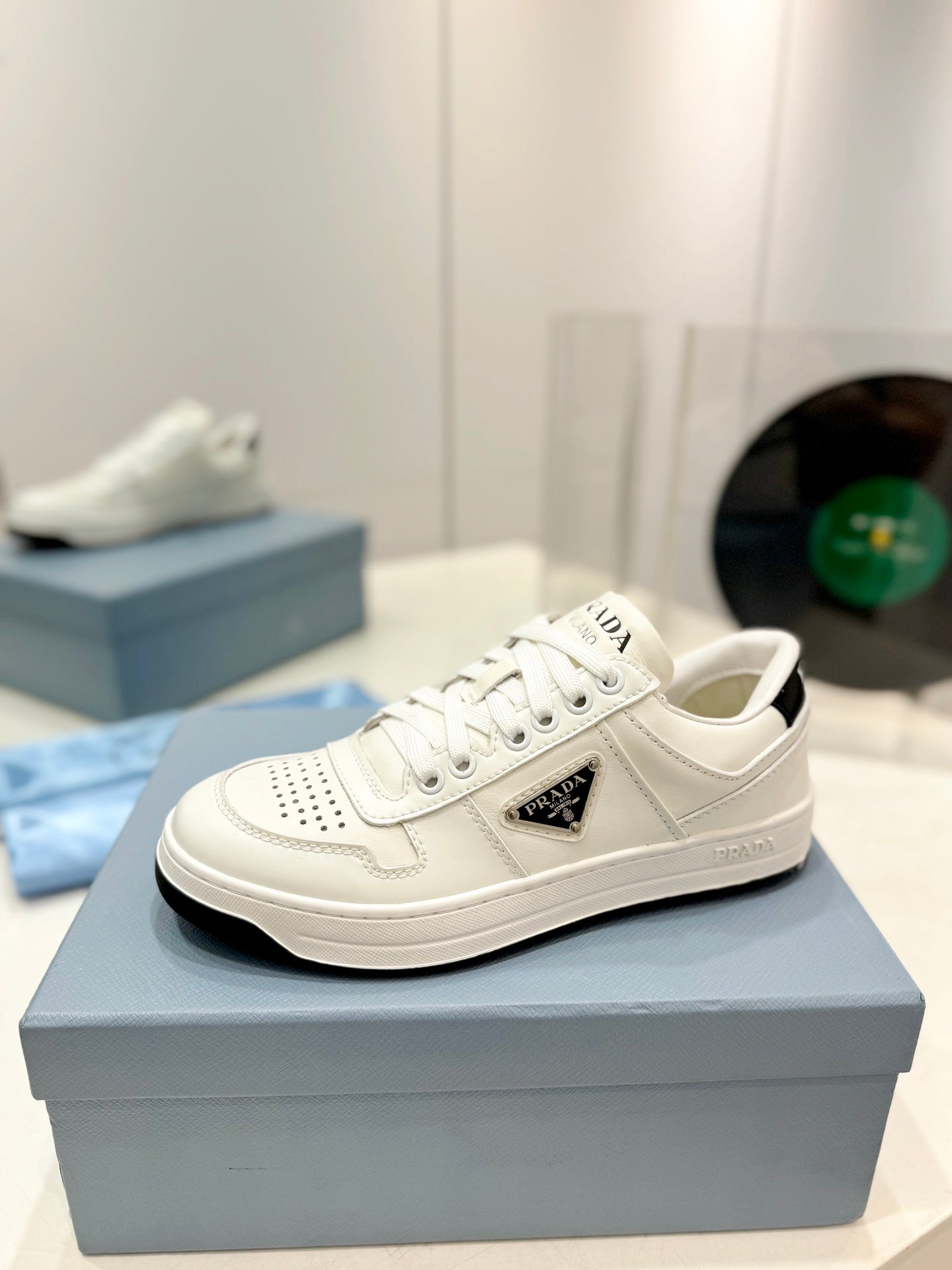 PRADA DOWNTOWN PERFORATED SNEAKERS WHITE AND BLACK LOGO CALFSKIN