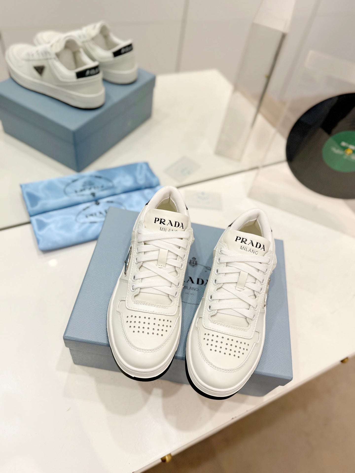 PRADA DOWNTOWN PERFORATED SNEAKERS WHITE AND BLACK LOGO CALFSKIN