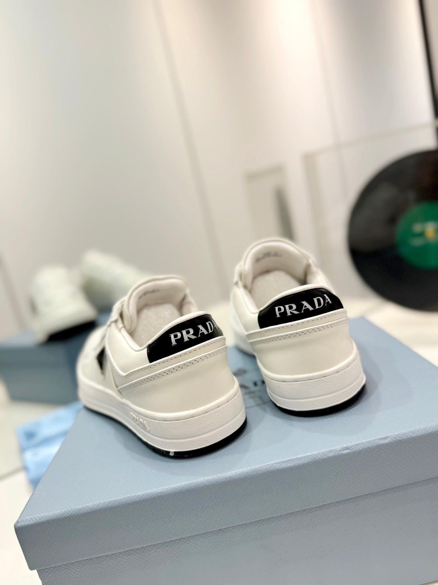 PRADA DOWNTOWN PERFORATED SNEAKERS WHITE AND BLACK LOGO CALFSKIN