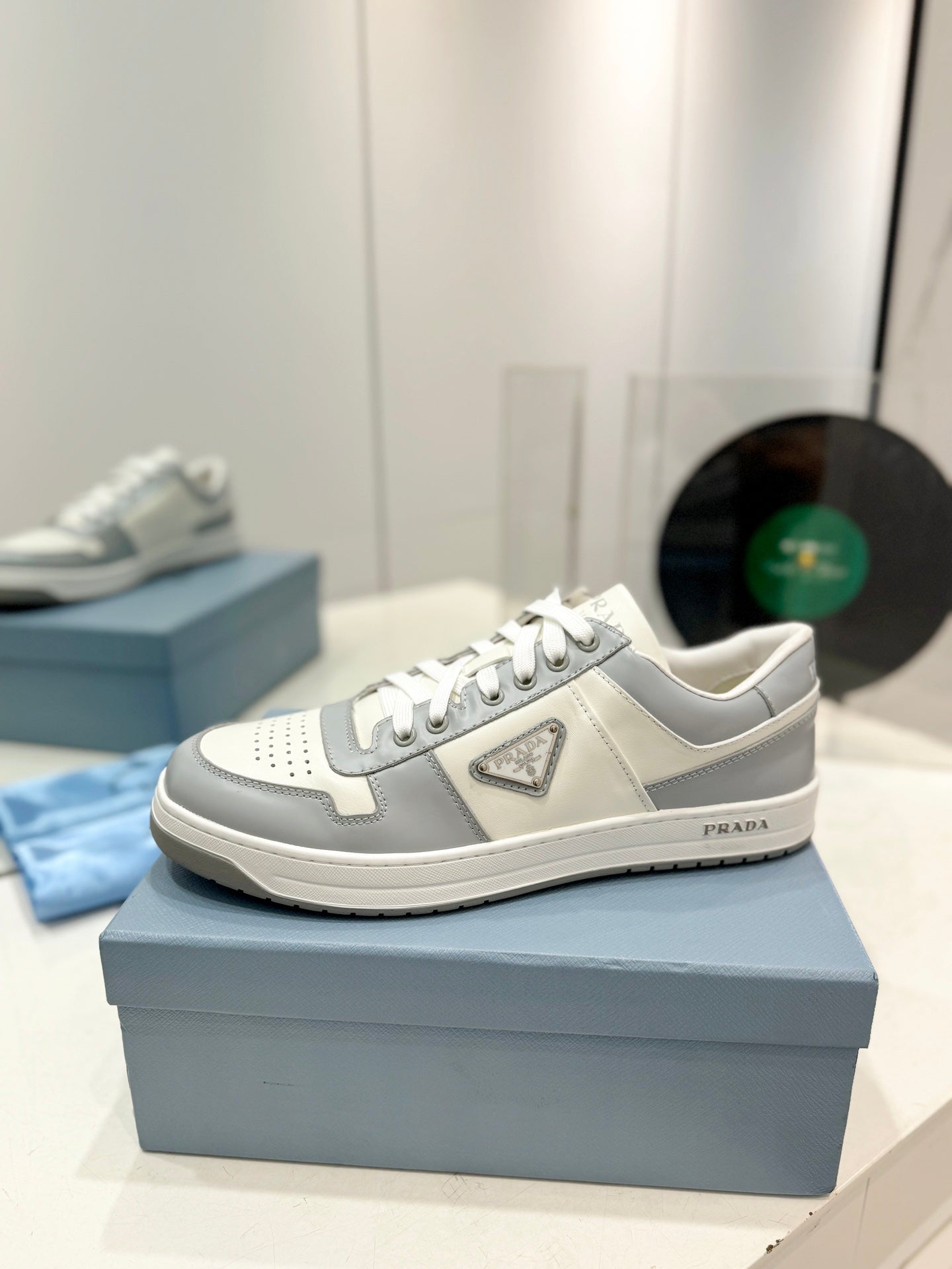 PRADA DOWNTOWN PERFORATED SNEAKERS WHITE AND GRAY CALFSKIN