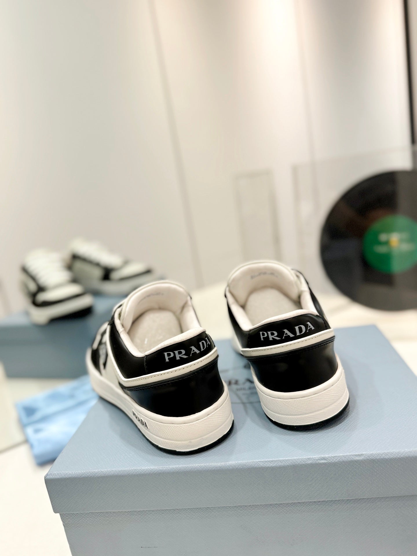 PRADA DOWNTOWN PERFORATED SNEAKERS BLACK AND WHITE CALFSKIN