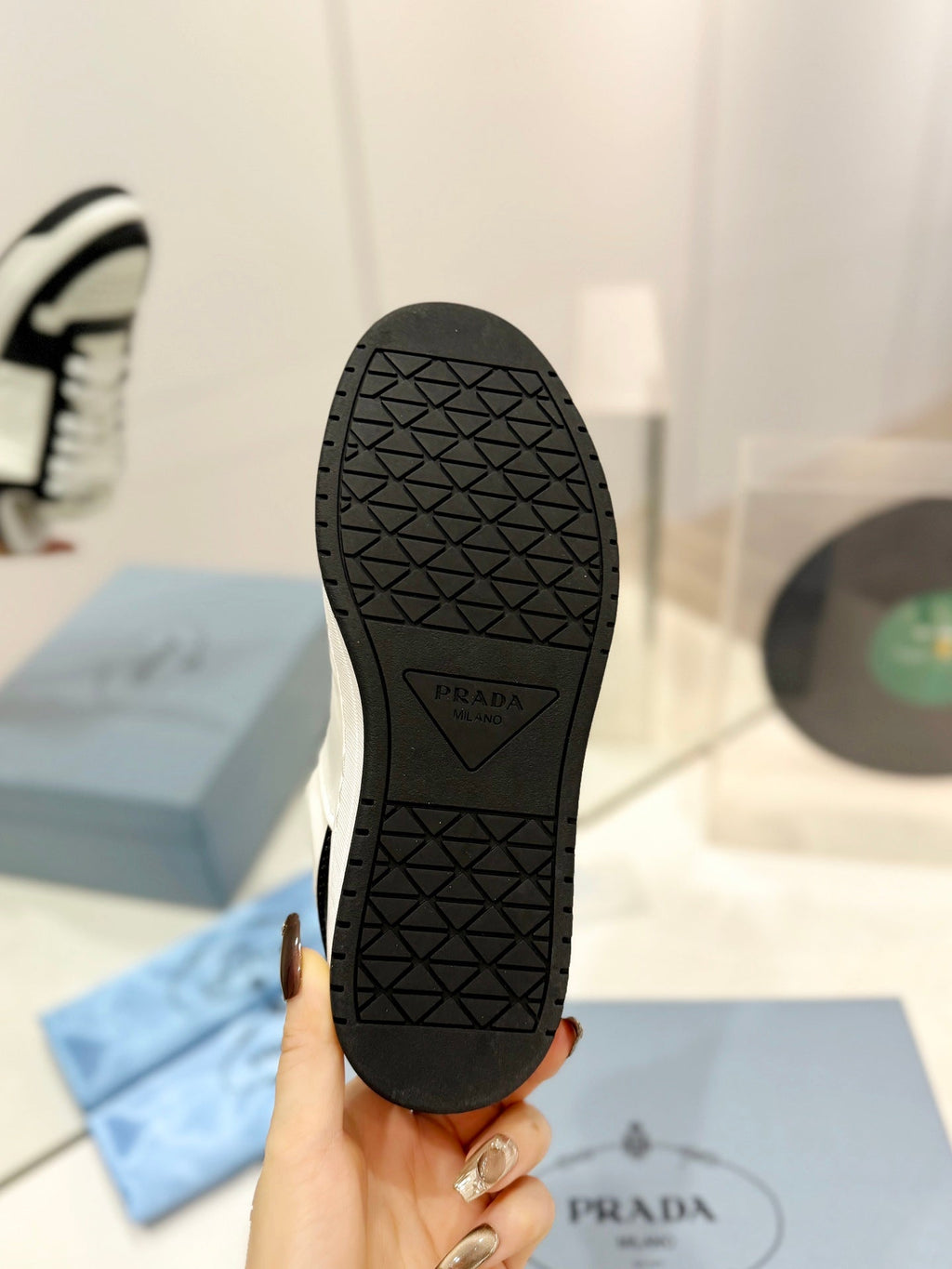 PRADA DOWNTOWN PERFORATED SNEAKERS BLACK AND WHITE CALFSKIN